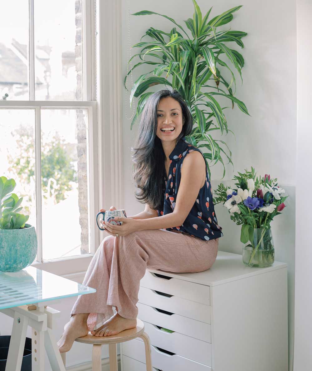 Artist Ingrid Sanchez (CreativeIngrid) in her studio, where she films her watercolor online classes.