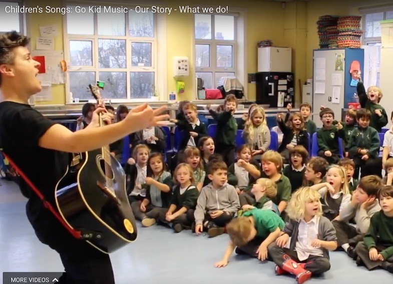 Al Start in singing assembly with school children