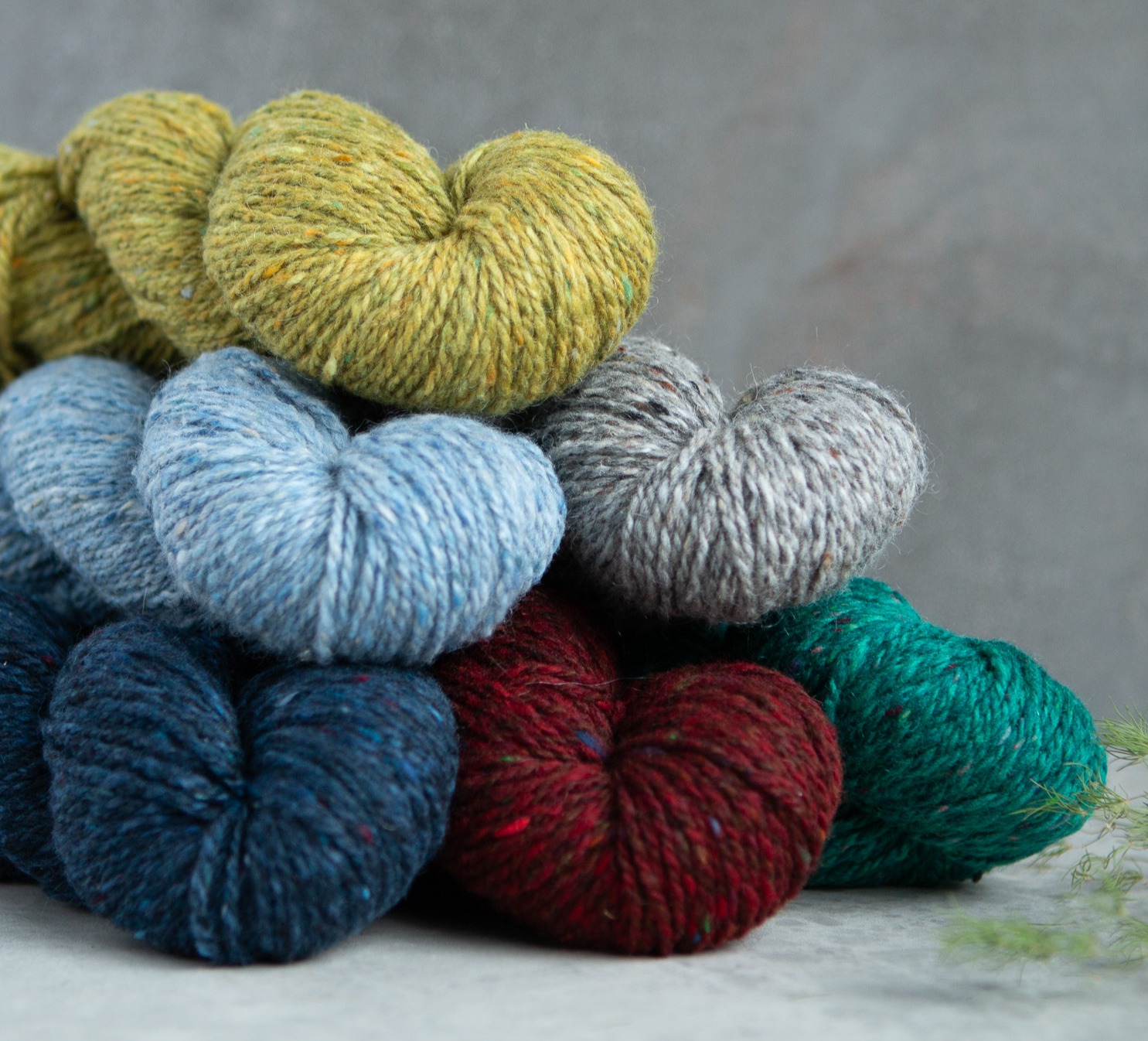 Deas yarn skeins in a pile.