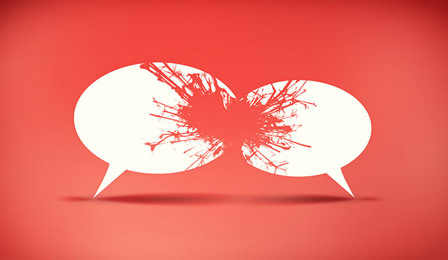 two speech bubbles crash into each other, exploding and cracking as a result of their collision