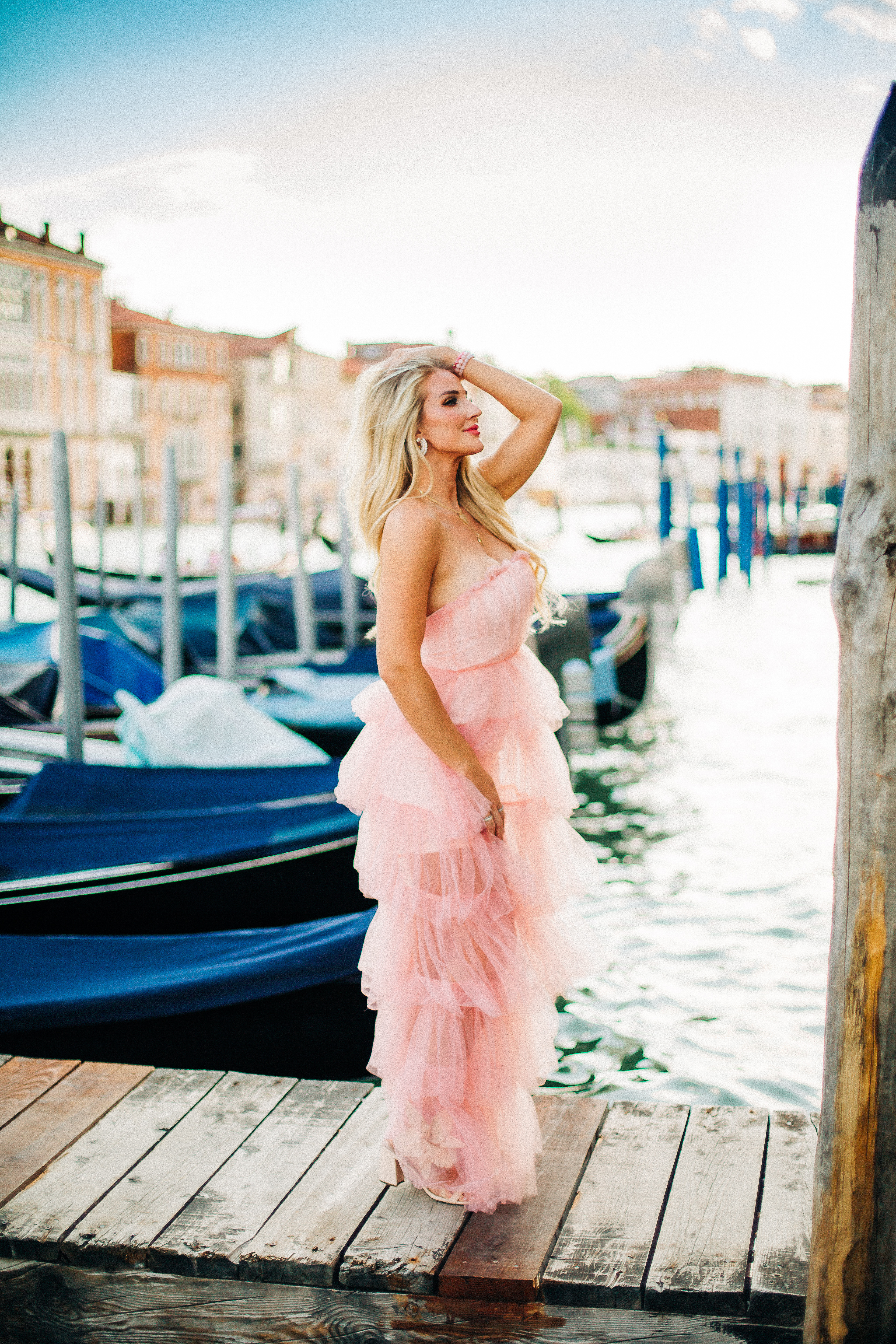 Jessica from Happily Hughes wearing a long pink tule dress from revolve