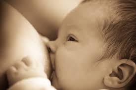 Baby breastfeeding closeup