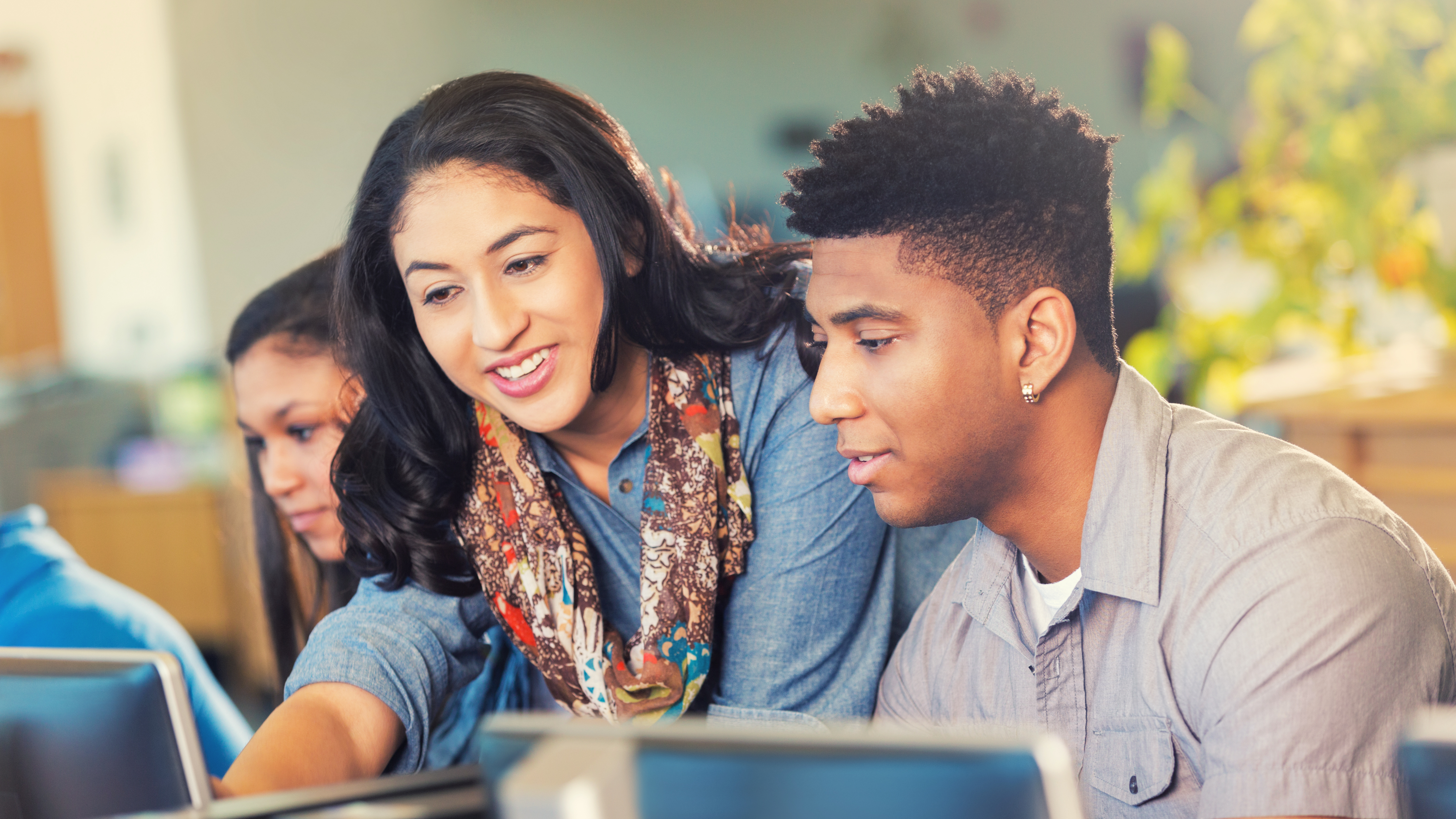 teacher working with students