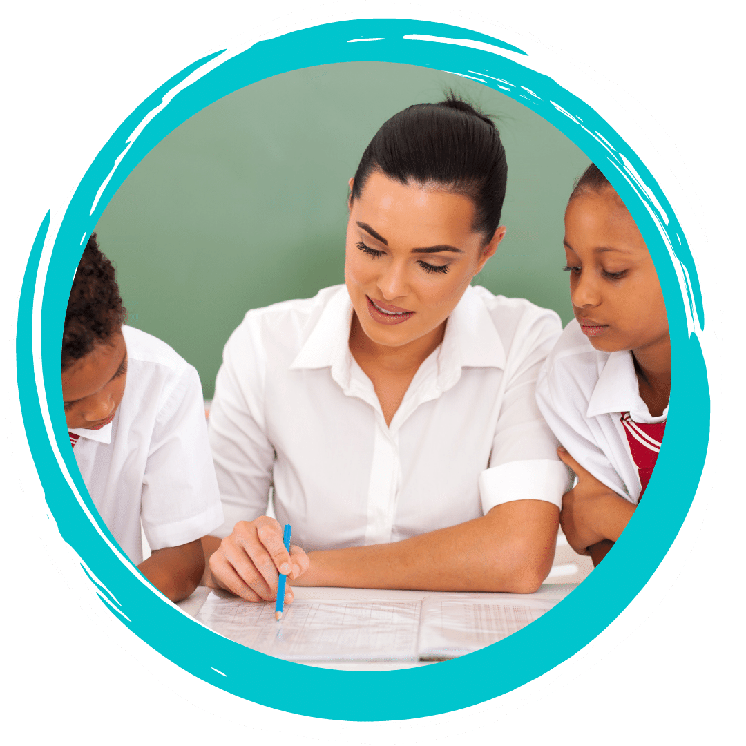 Teacher with two young students looking at a notebook.