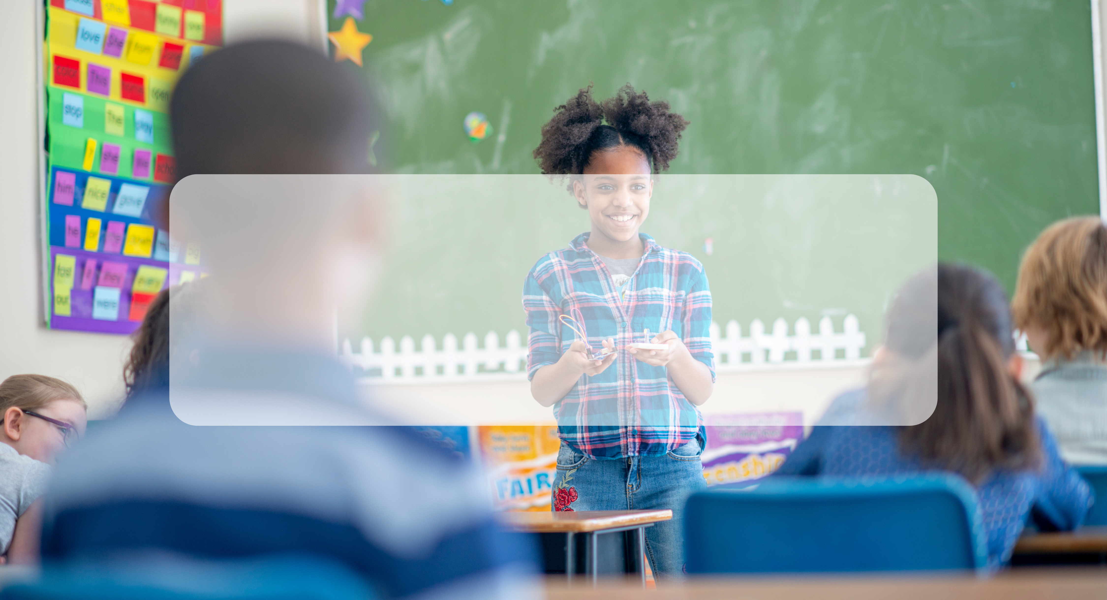 student standing in front of classroom presenting