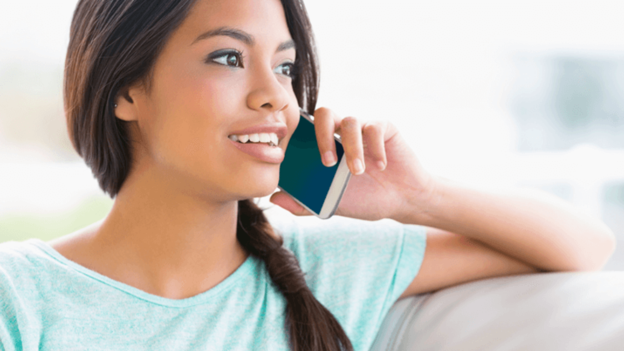 A Sad Shocked woman speaking with the Phone in the Street. Www talk