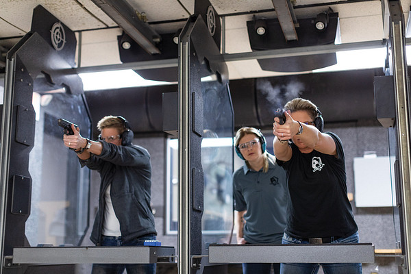 Firearms instructor teaching student