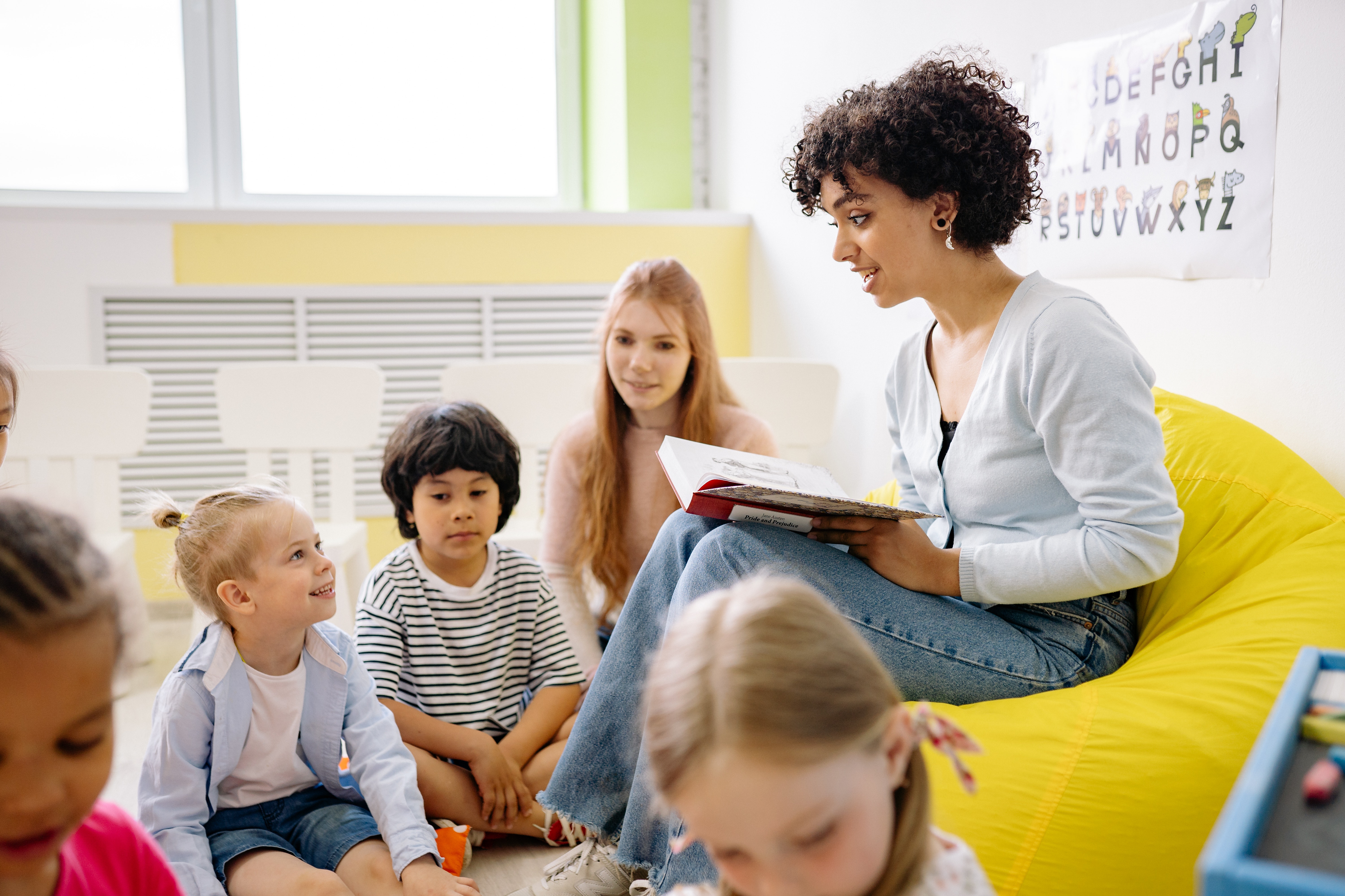 teacher reading to small group of students