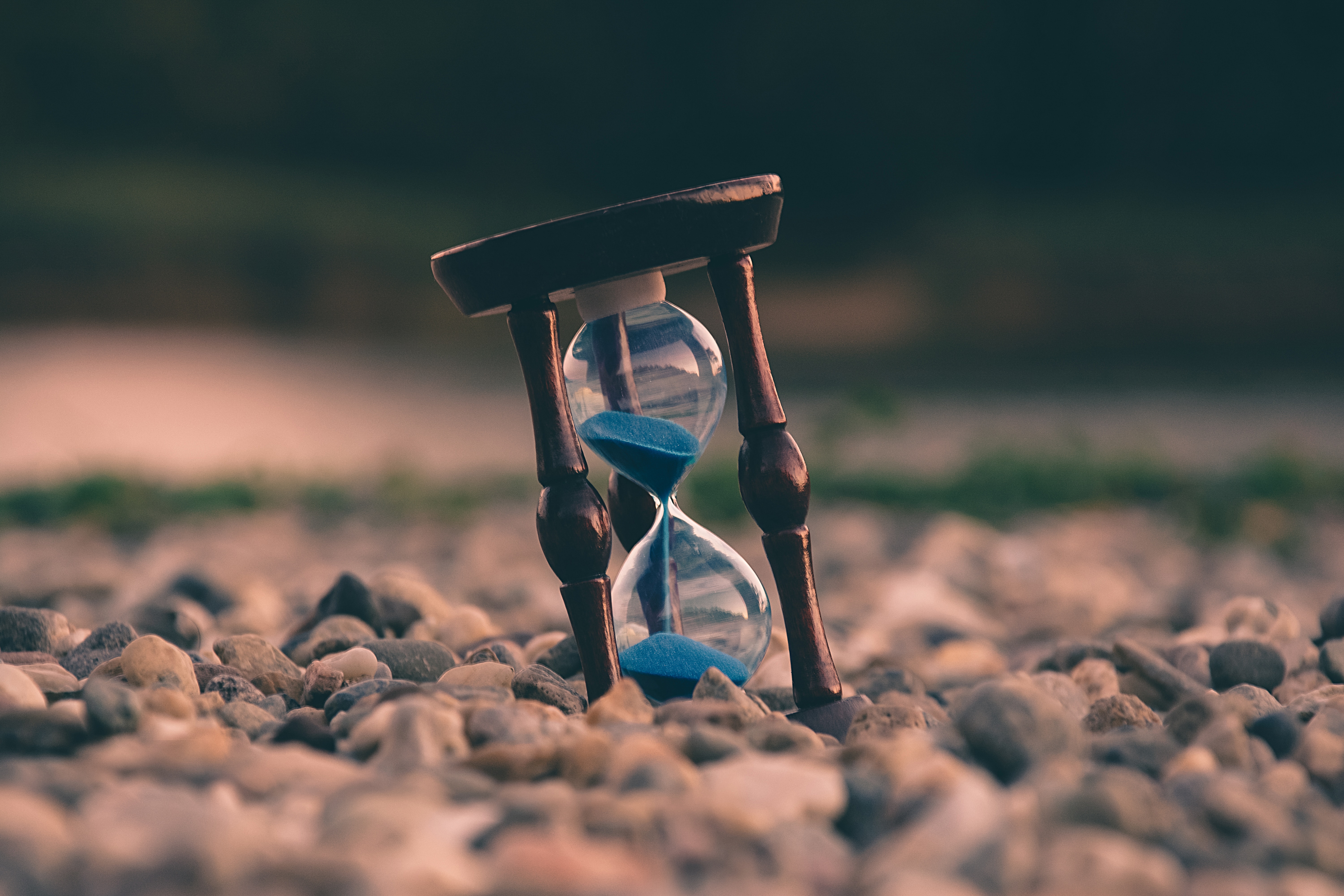 Hourglass sitting on stones