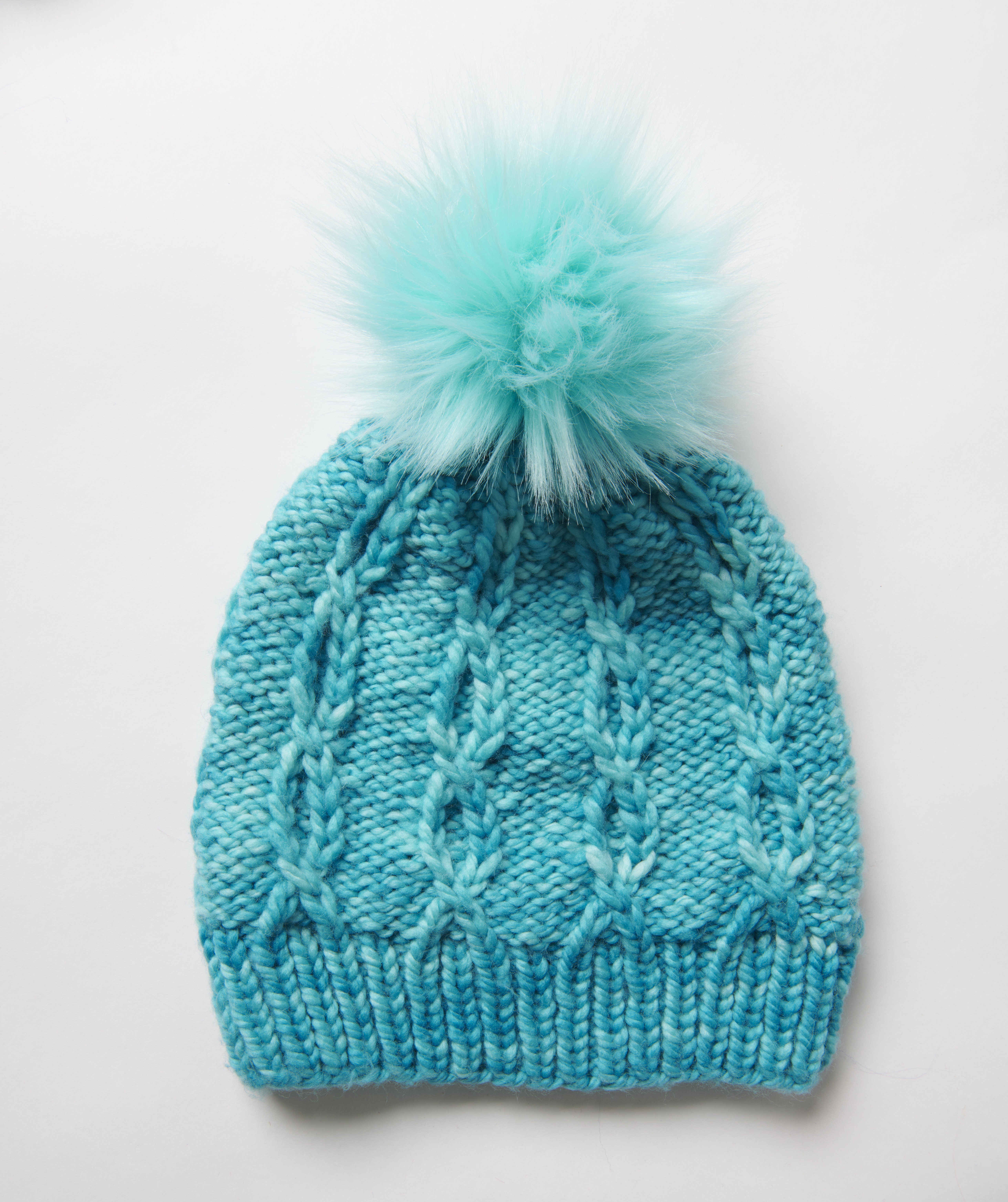 cabled knit hat with pom