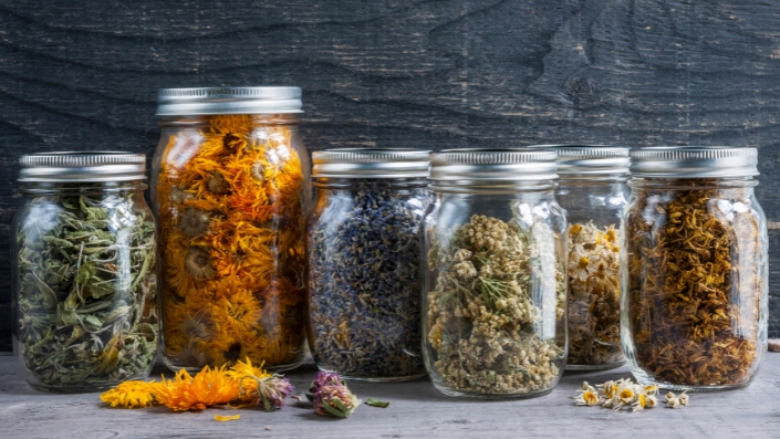 Mason jars filled with dried herbs