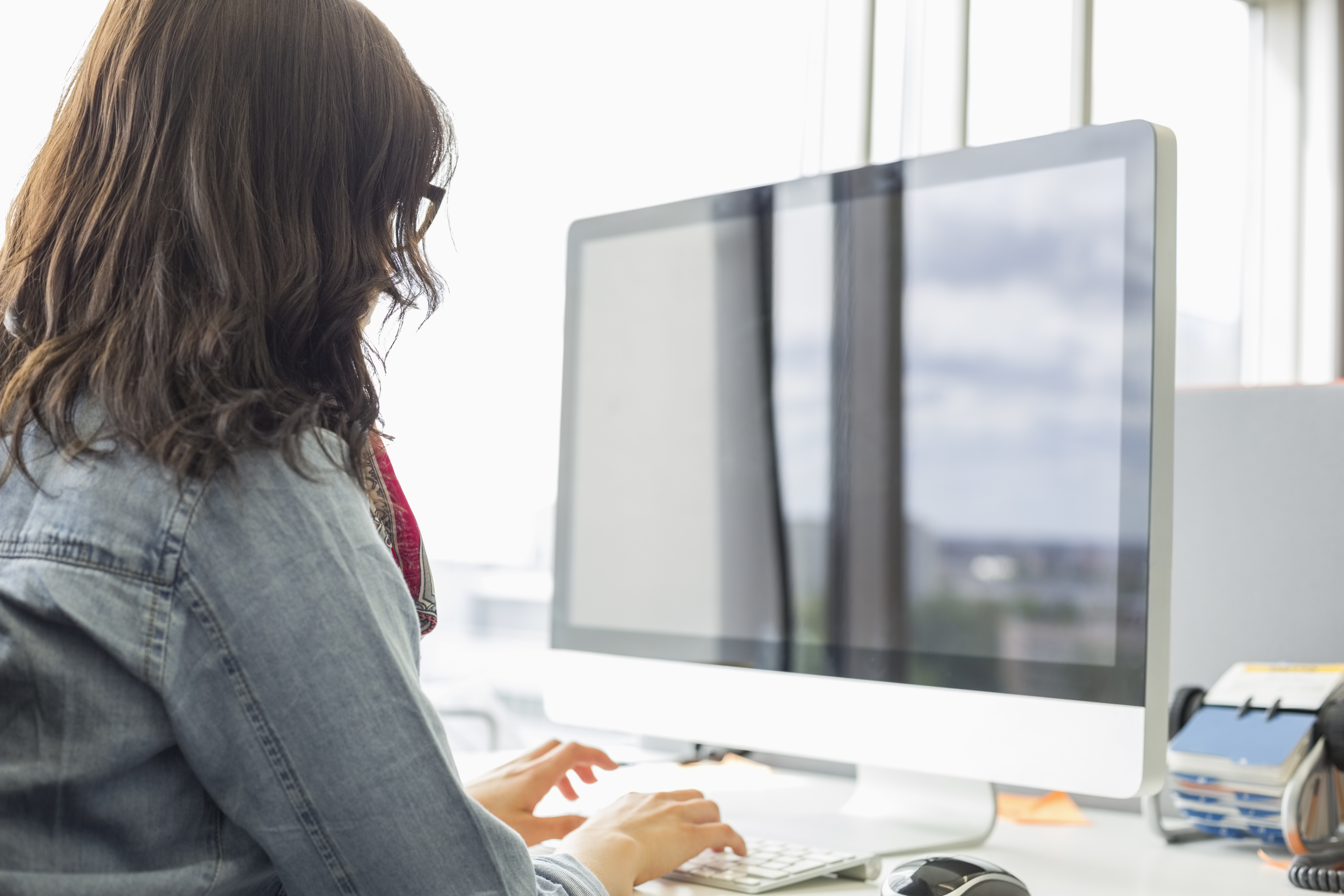 Woman typing on computer