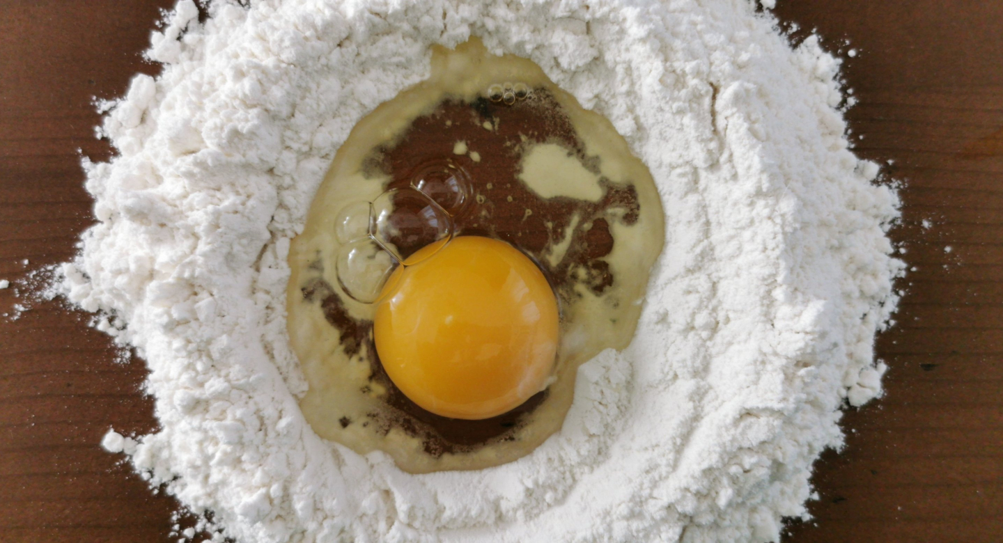 Flour well with egg inside