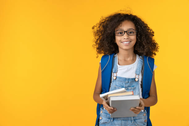 Child with books and backpack