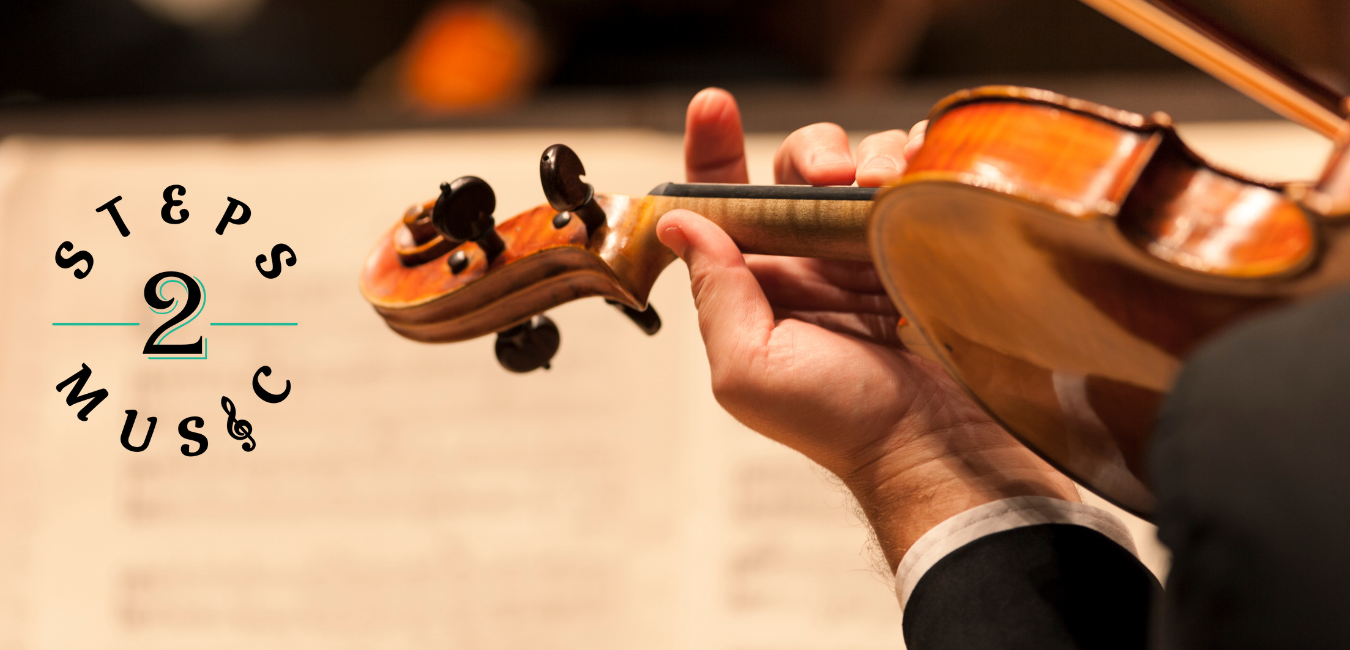 Violin students perform in a string orchestra