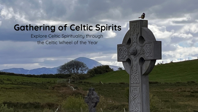 View of Celtic Cross before a green pasture and mountain range