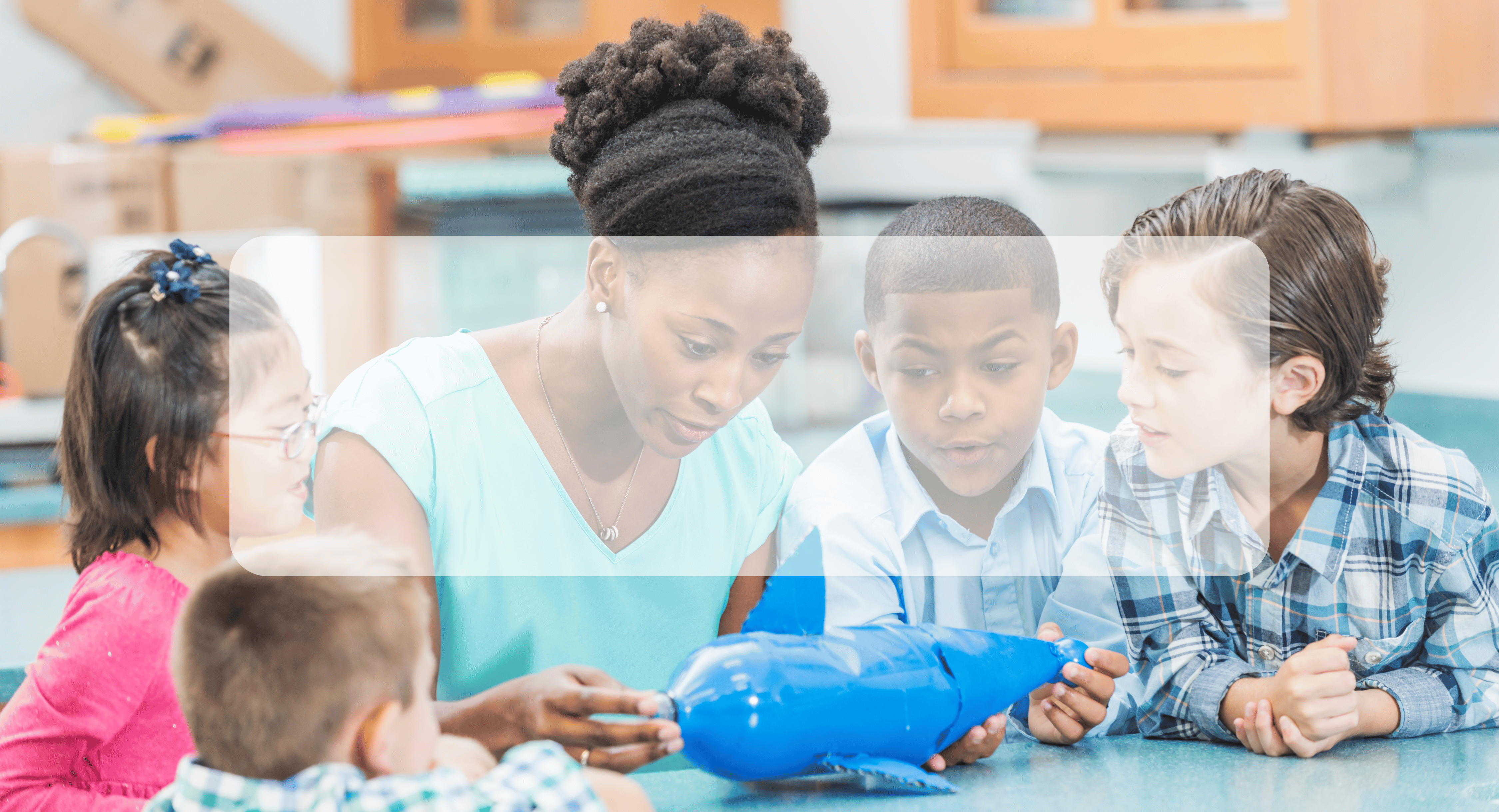 teacher modeling science concept with students observing