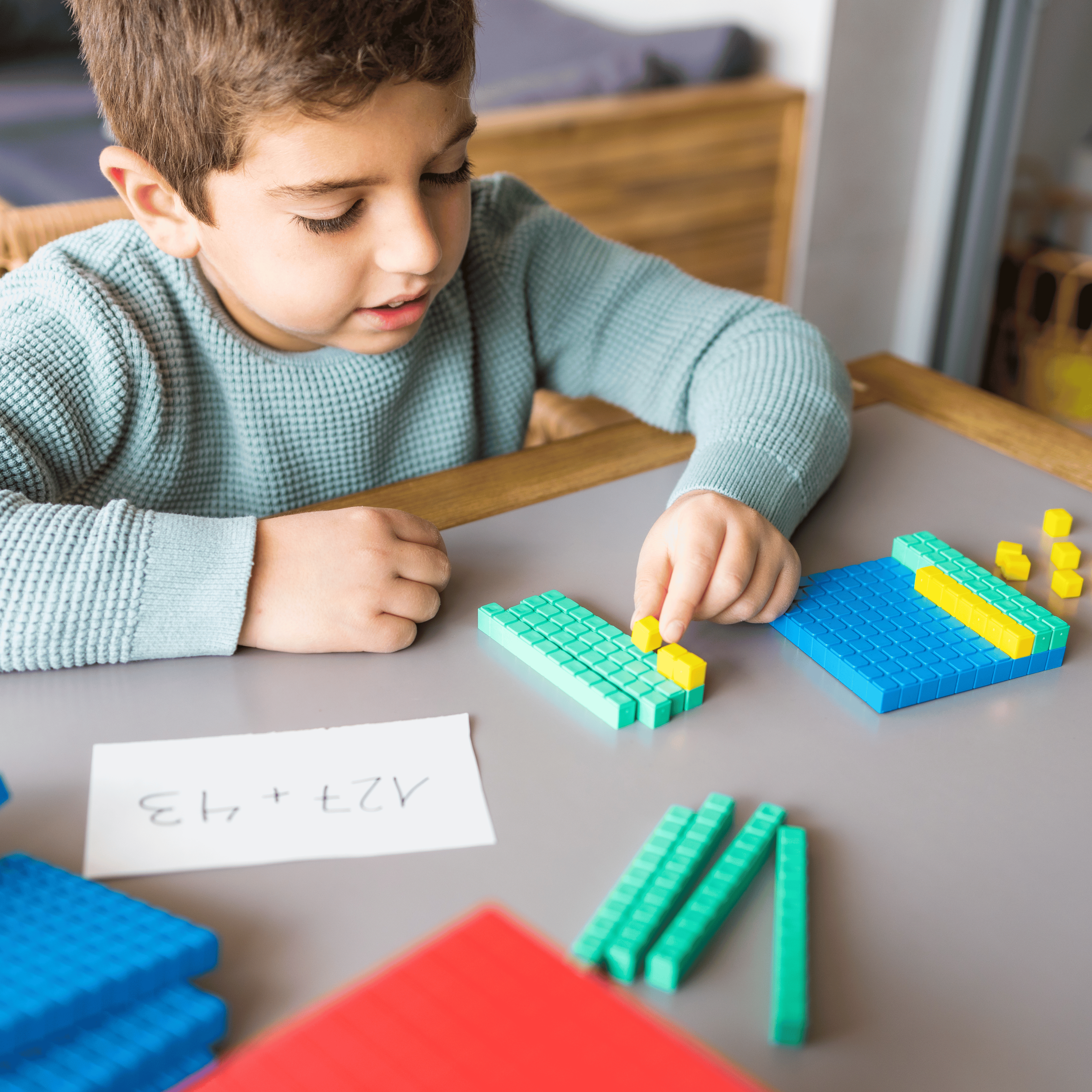 student using base ten blocks