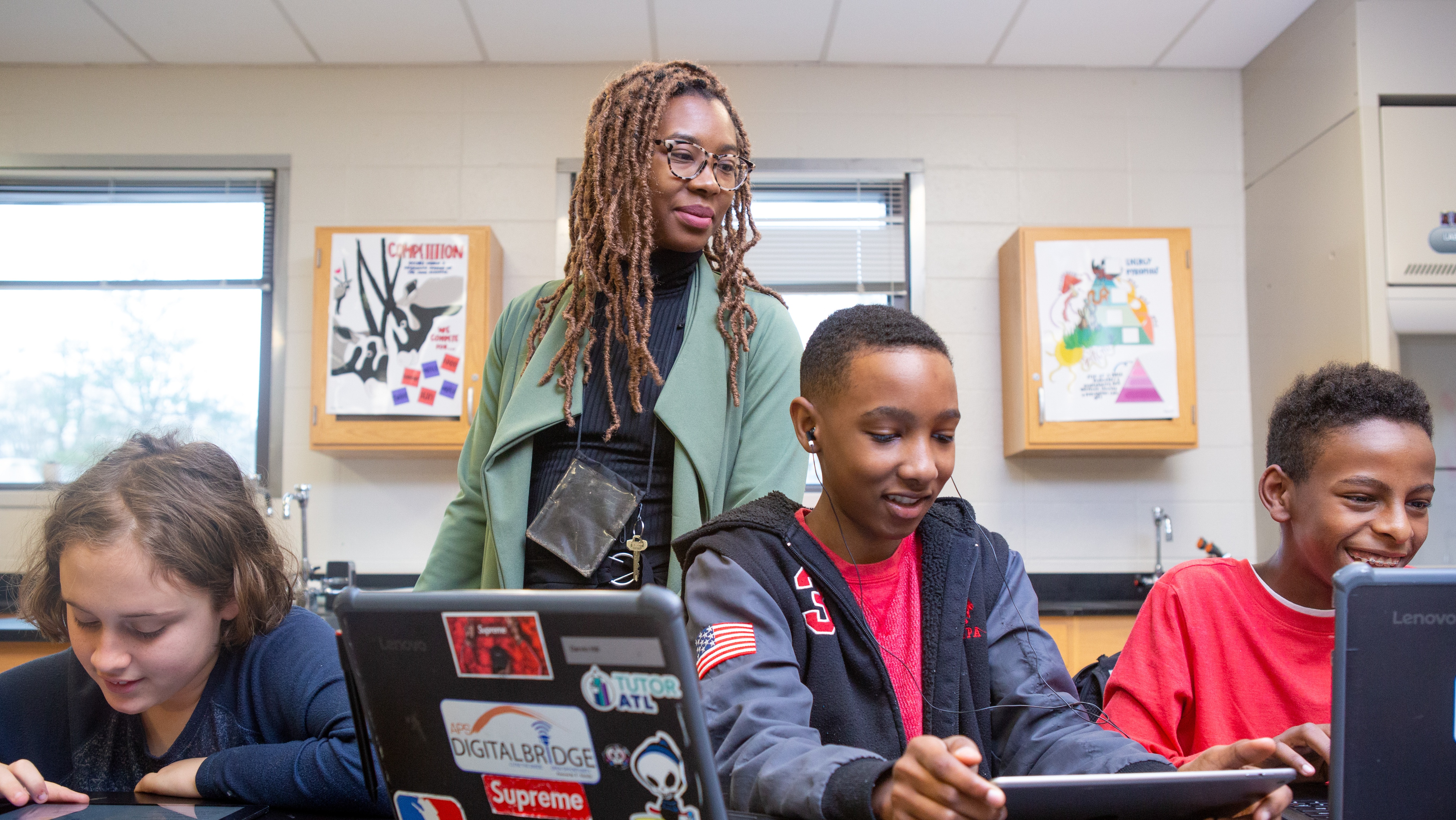 Students at Sutton Middle School use online research to answer questions during a lesson in history class.