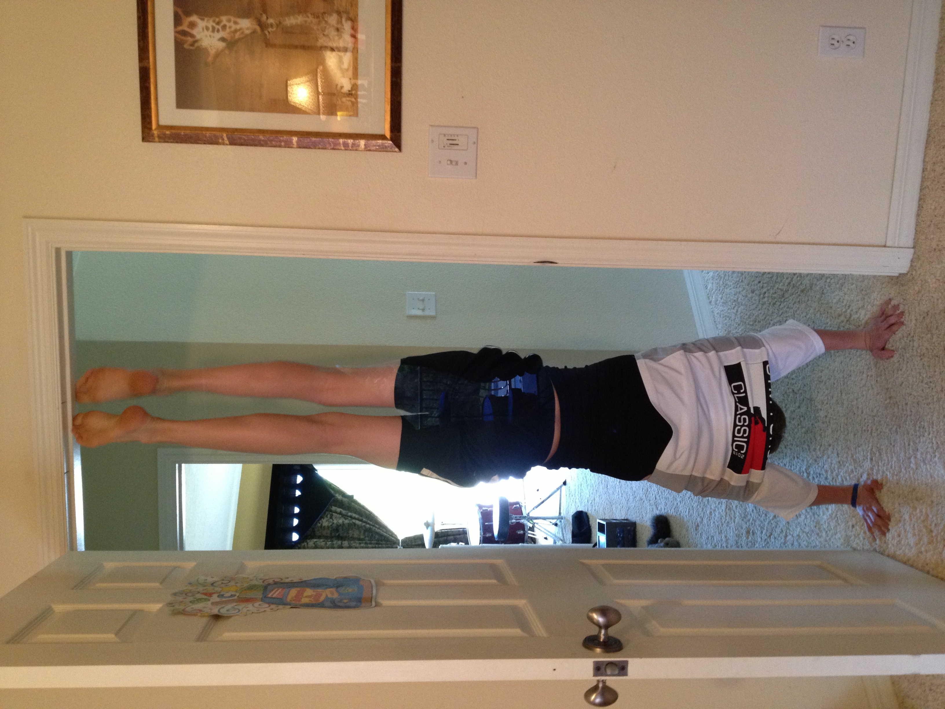 upside-down teen in doorway