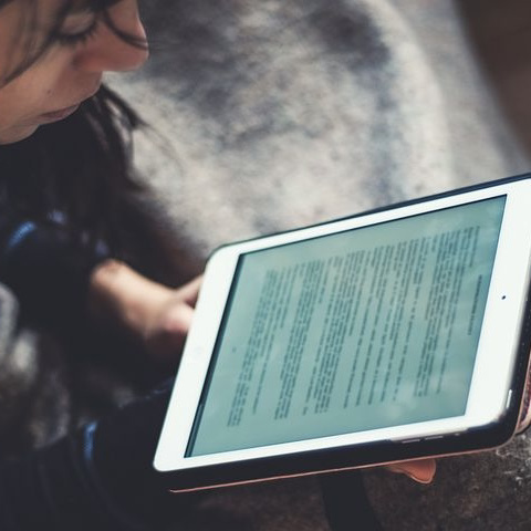 Woman reading from iPad 