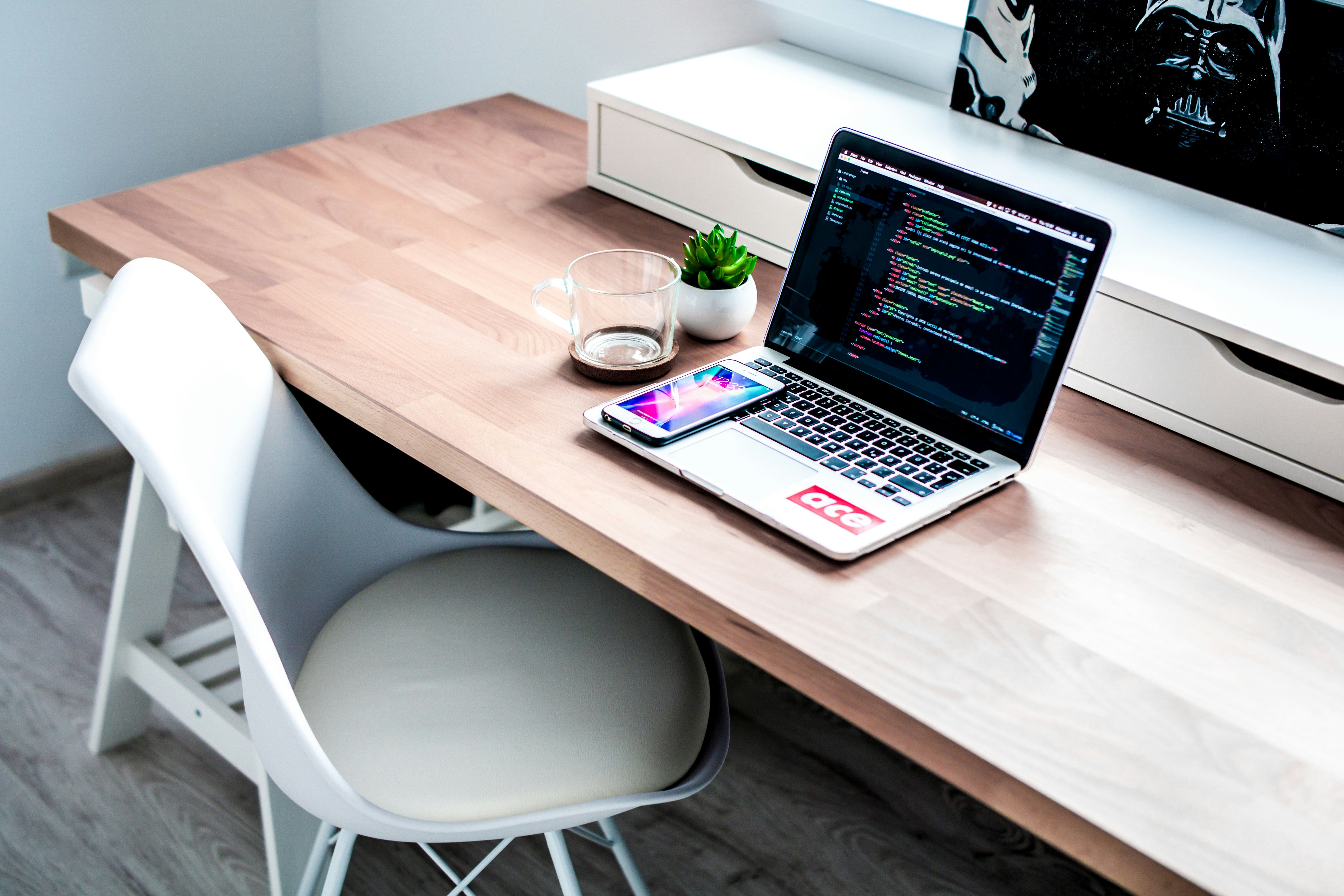 Chair by table with open lap top