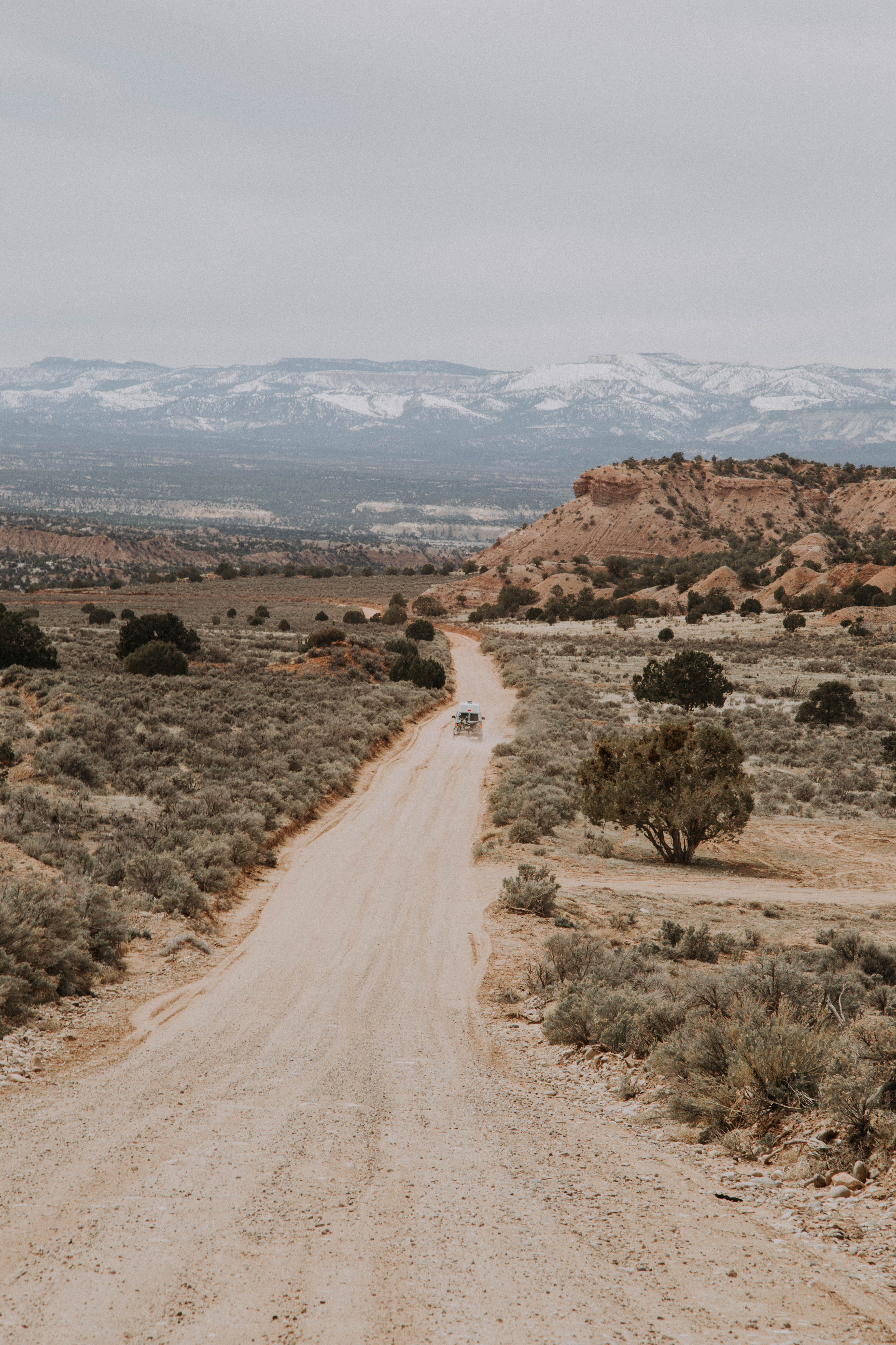 Van Driving down a dirt road