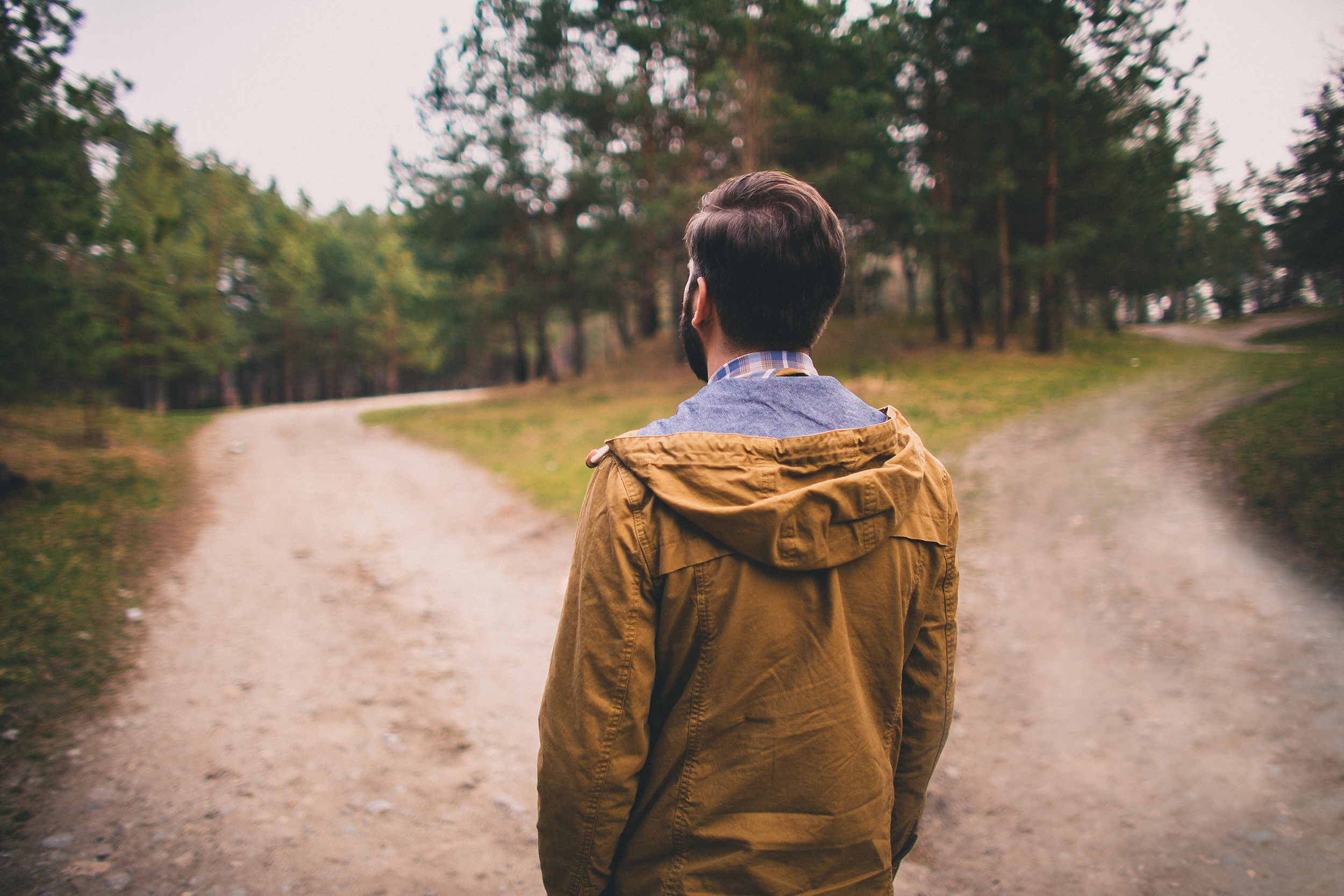 Man deciding which road to take