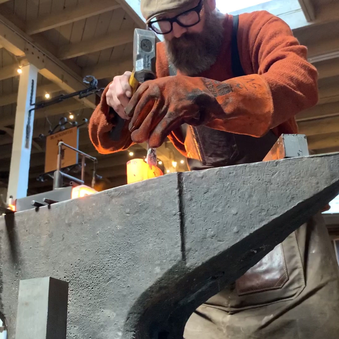 Yori Seeger blacksmithing at the forge