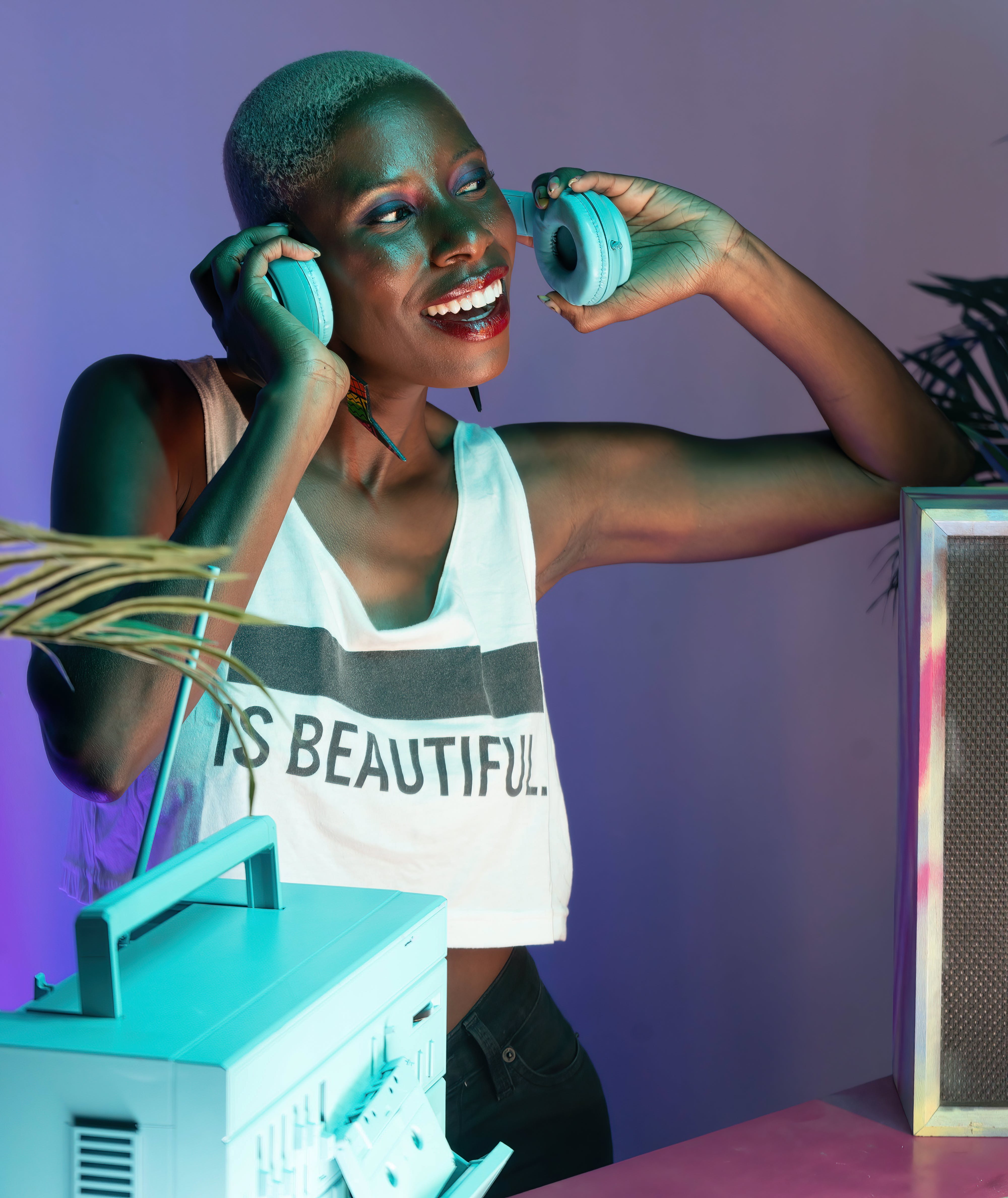 Photo by Monica Griffin: https://www.pexels.com/photo/happy-woman-dj-with-headphones-12686129/