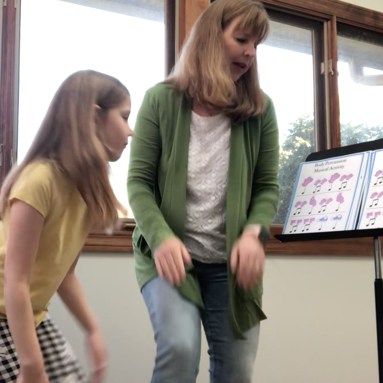 Gena and daughter doing body percussion music lesson