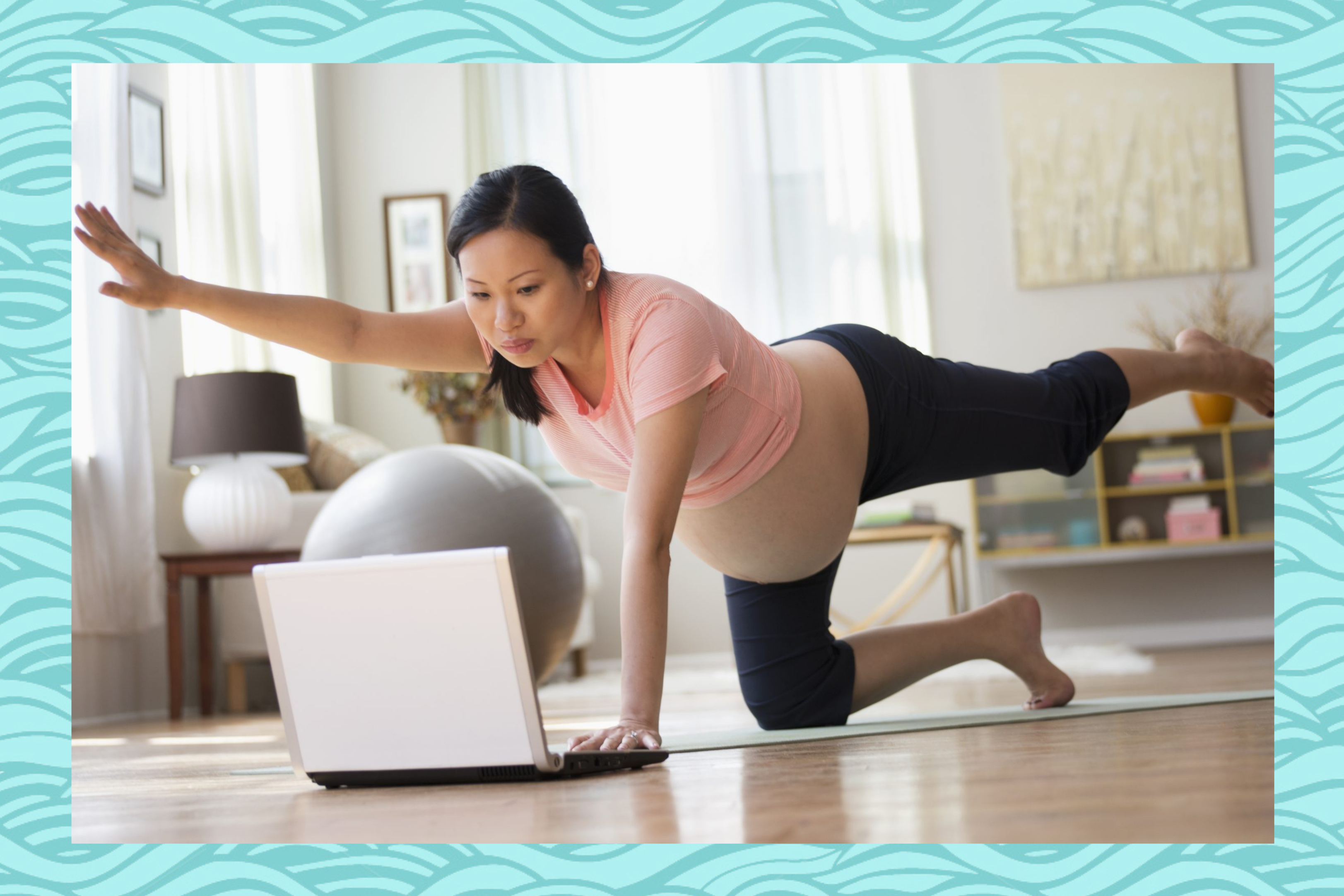 Pregnant woman practicing yoga online on a computer