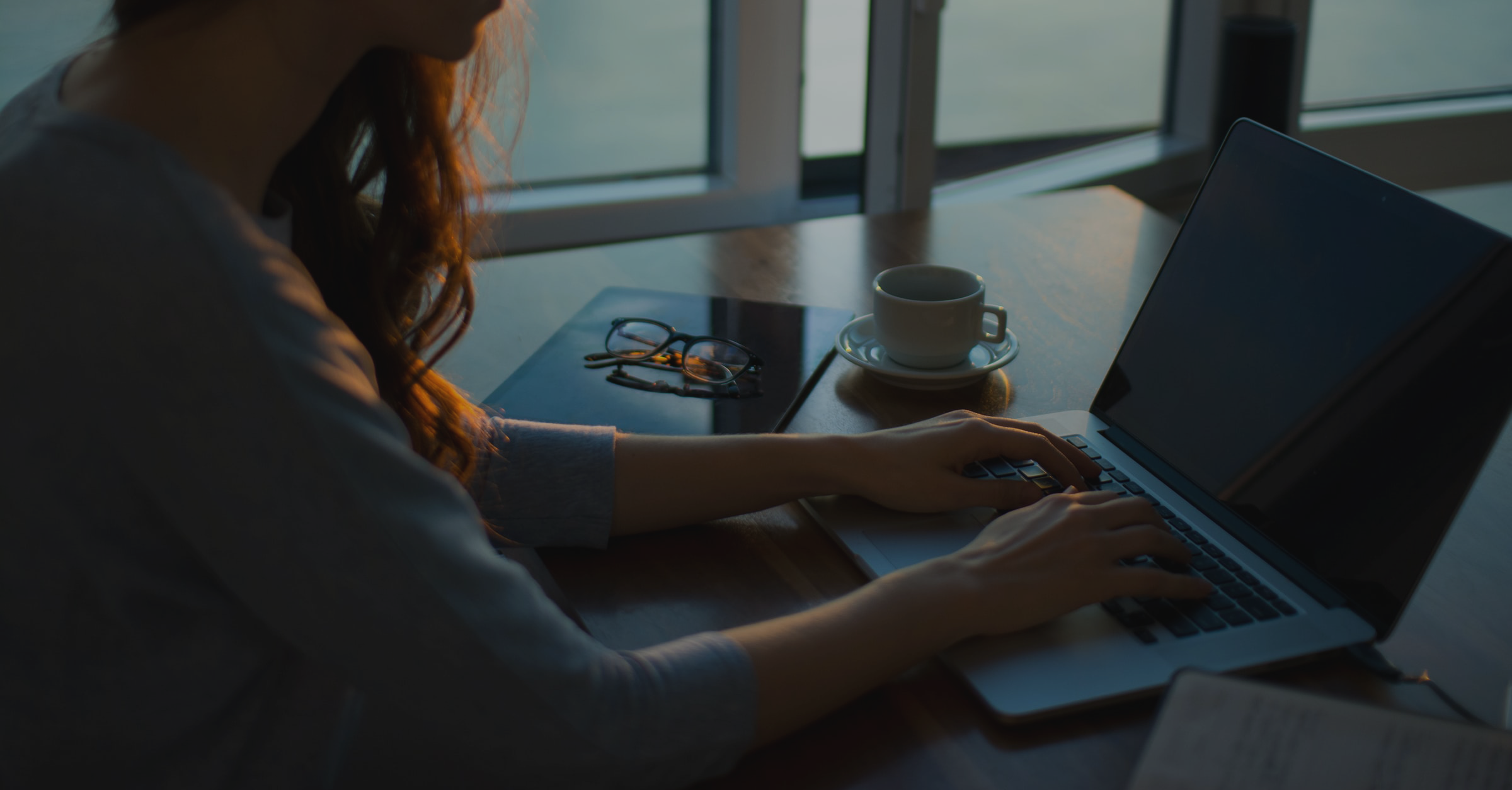 Woman at home with a laptop