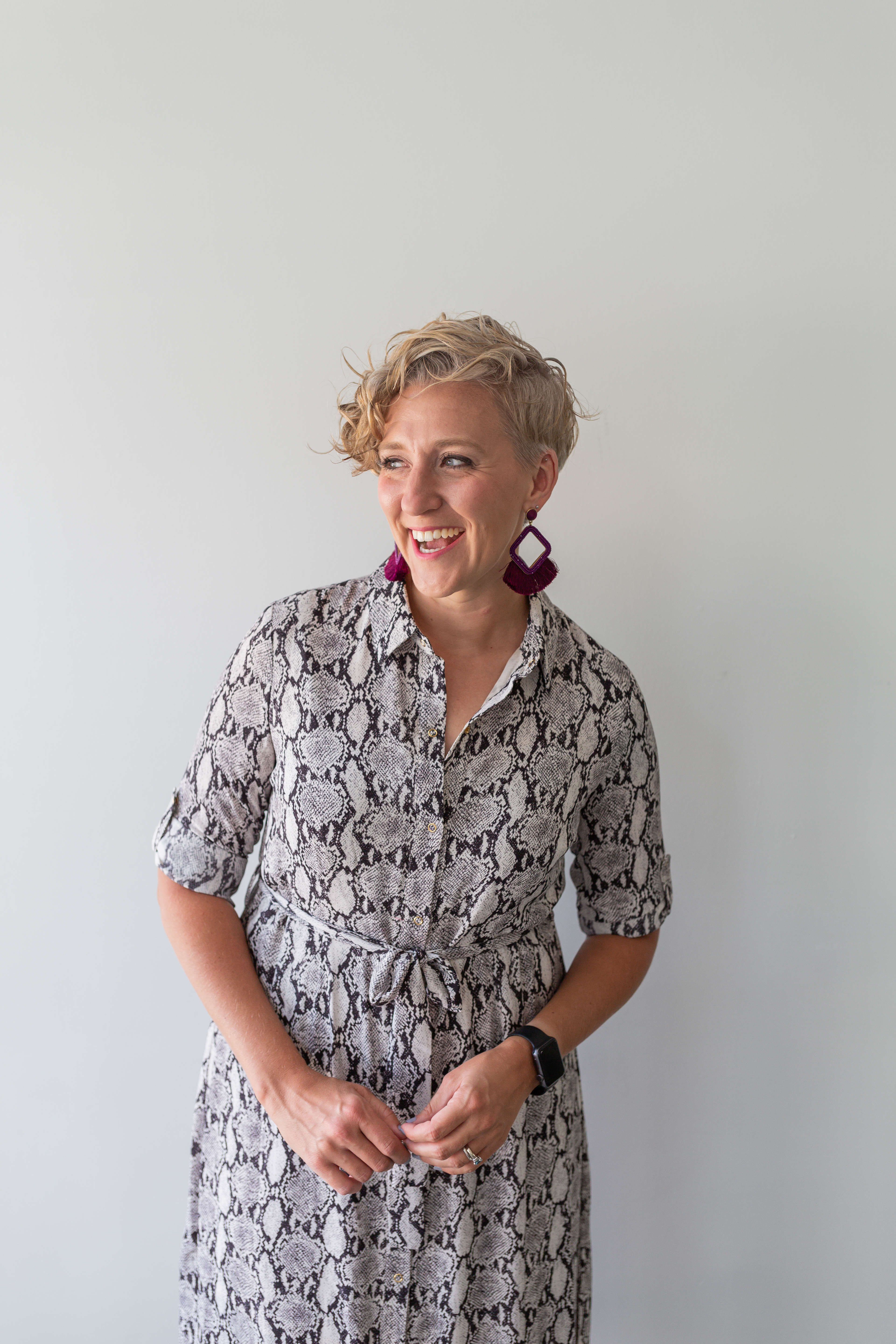 social media coach, blonde curly hair girl on green couch