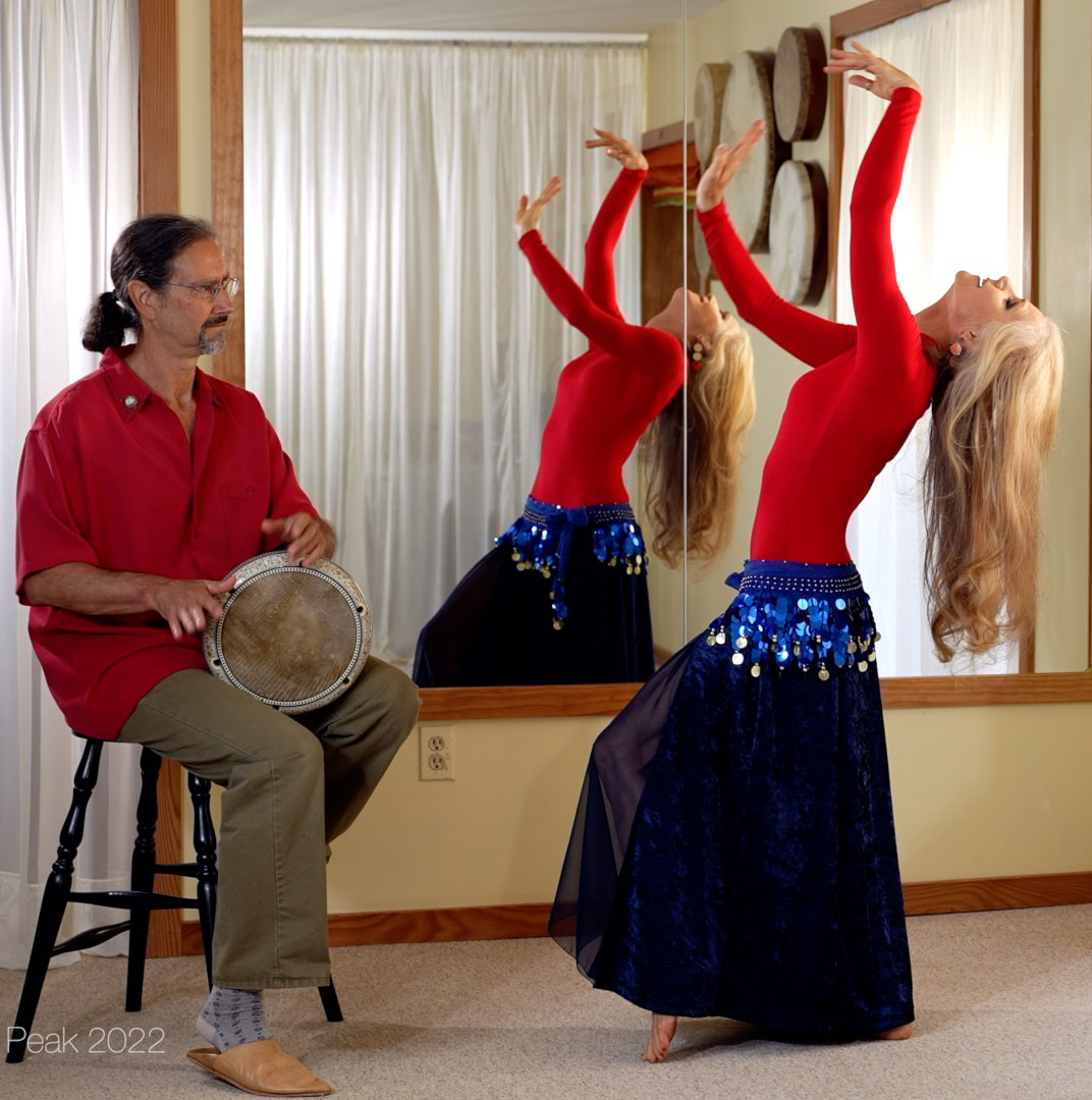 Jensuya and Bob with drum teaching belly dance in studio