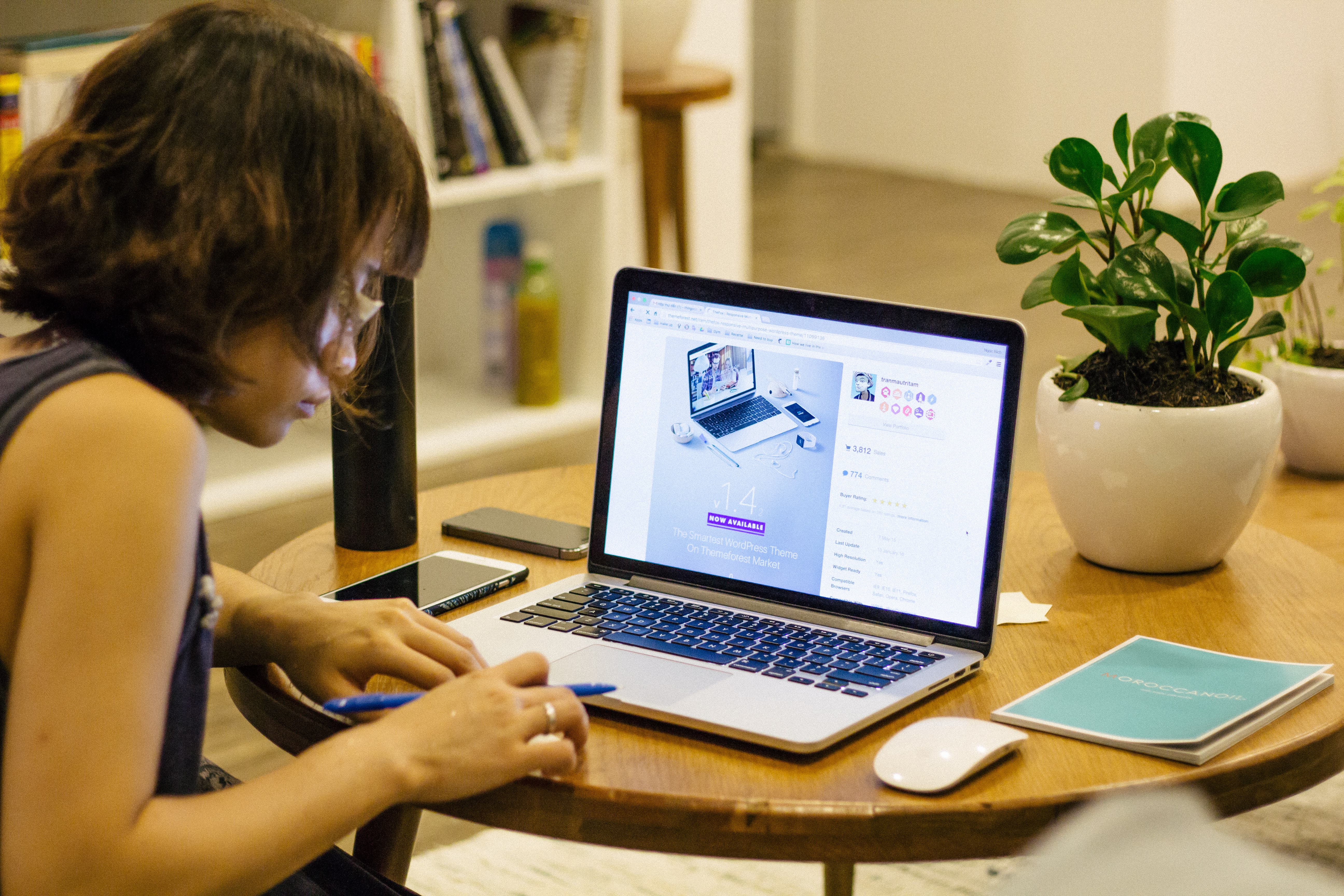 woman using laptop on desk