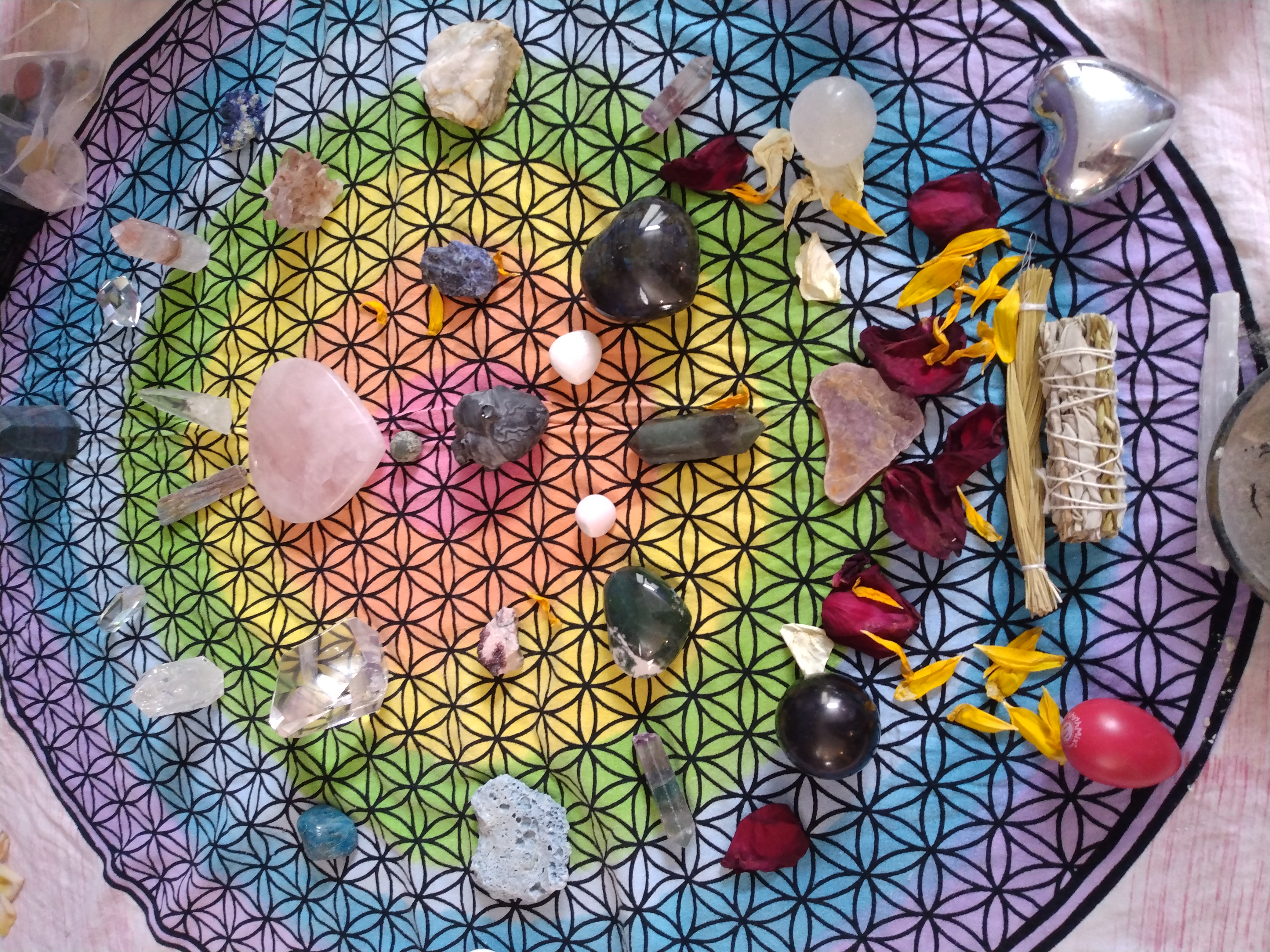 a crystal grid on a colorful textile with the seed of life image
