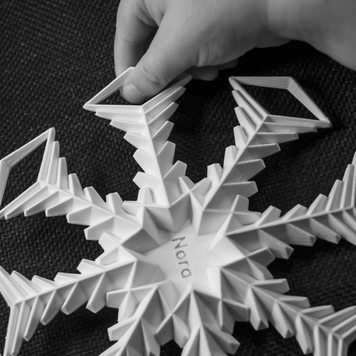 Picture showing a snowflake in child's hand