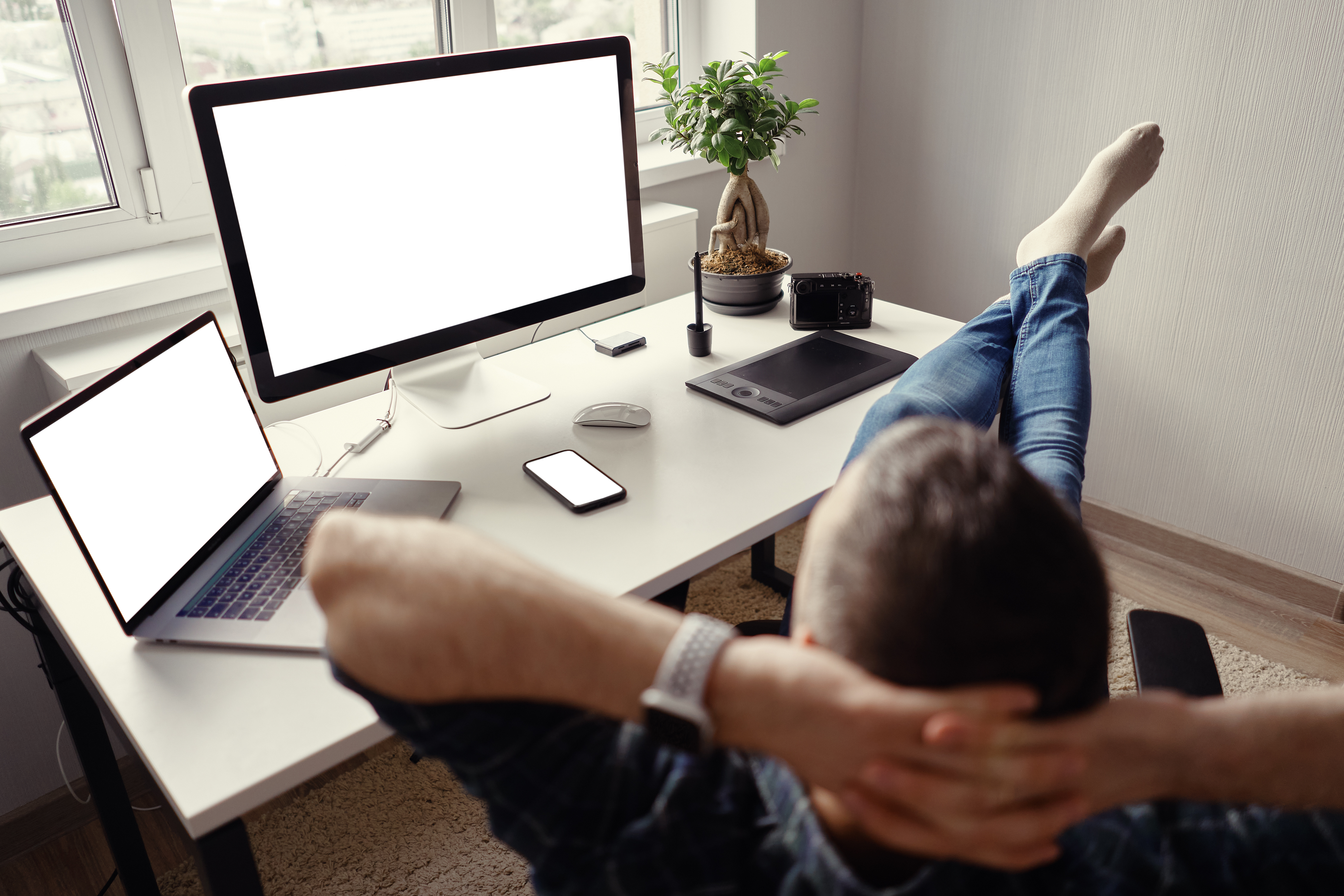 guy at desk feet up