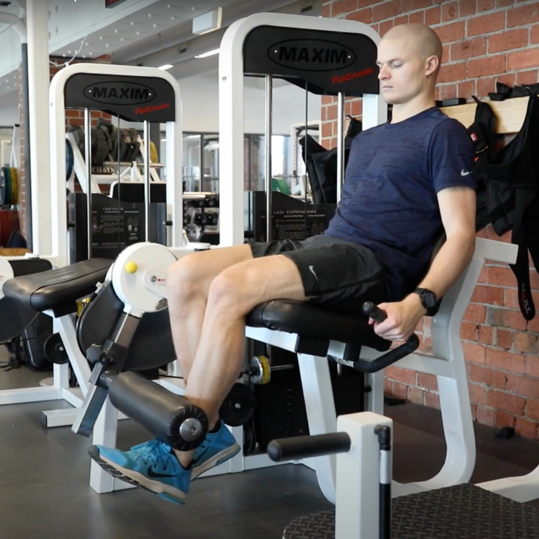 Man recovering from ACL reconstruction. Hamstring and ACL exercises.
