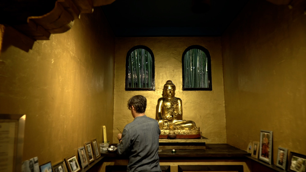 Martin carefully attending to a shrine