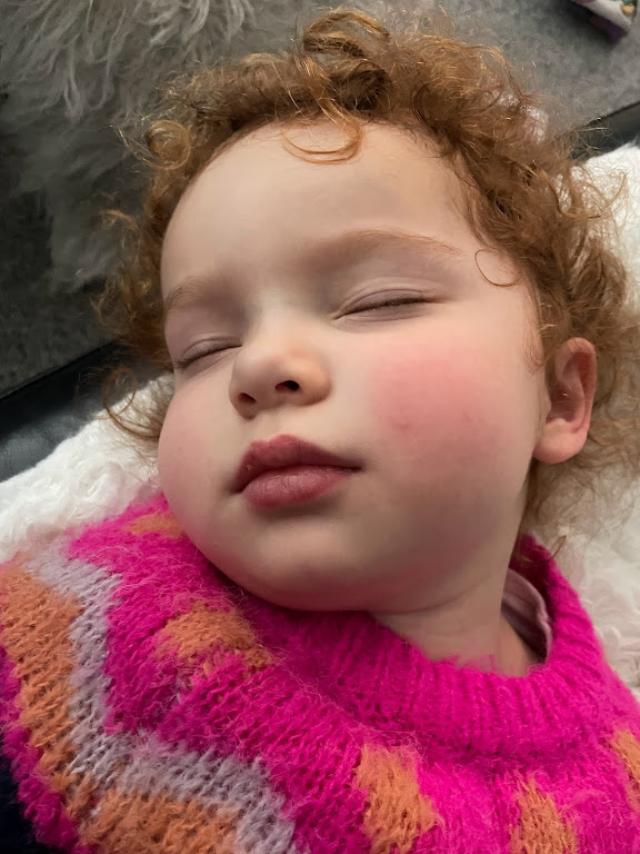 red haired child sleeping peacefully