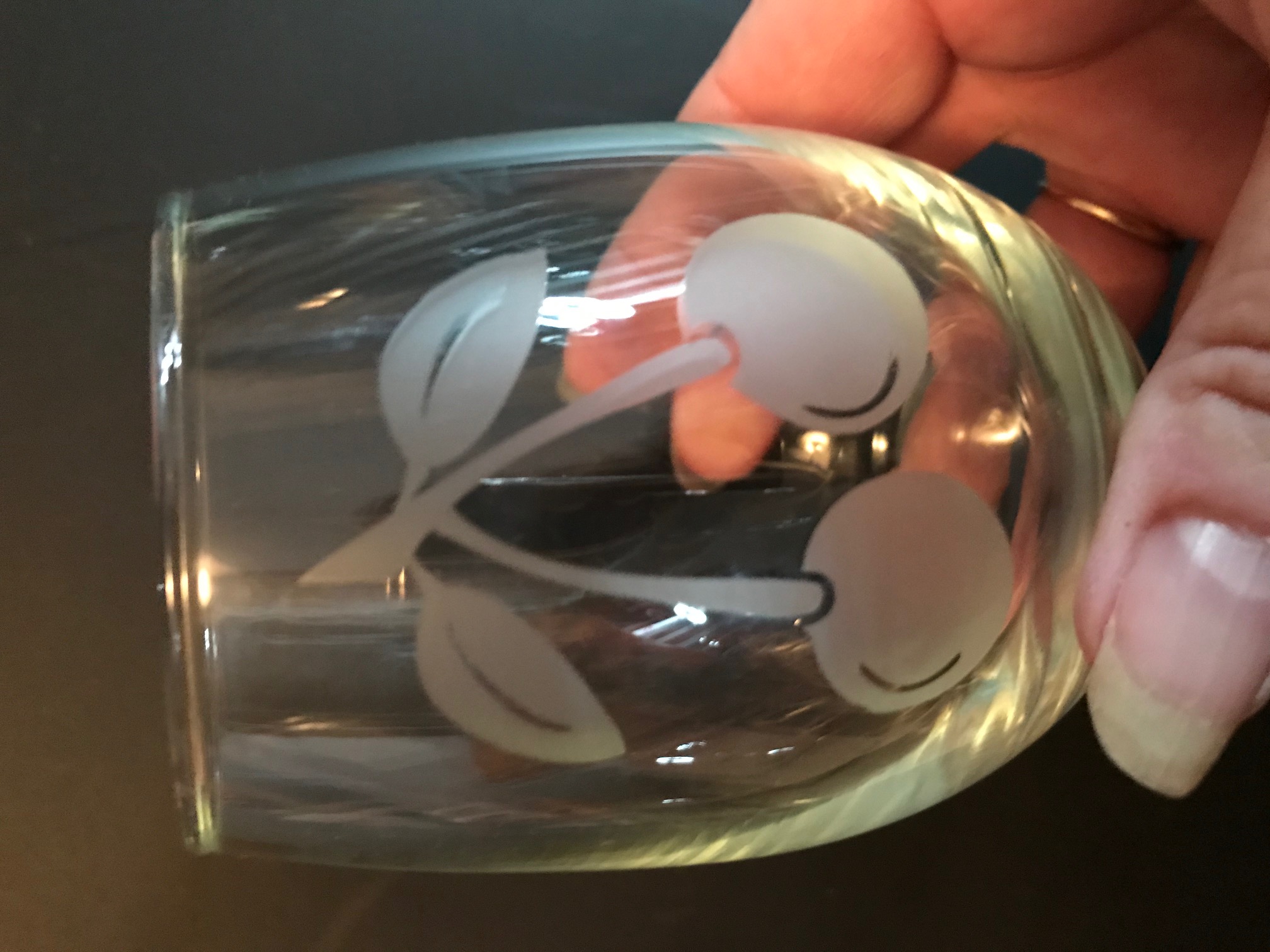 Etched cherries on stemless wine glass