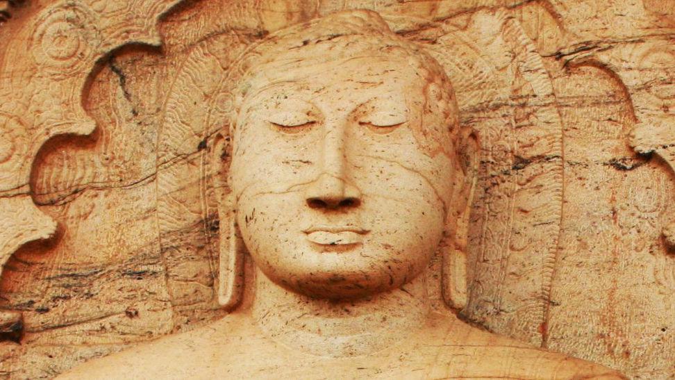 The Buddha, carved into a rock face