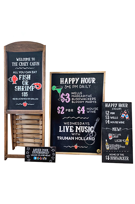A collection of business and restaurant chalkboards