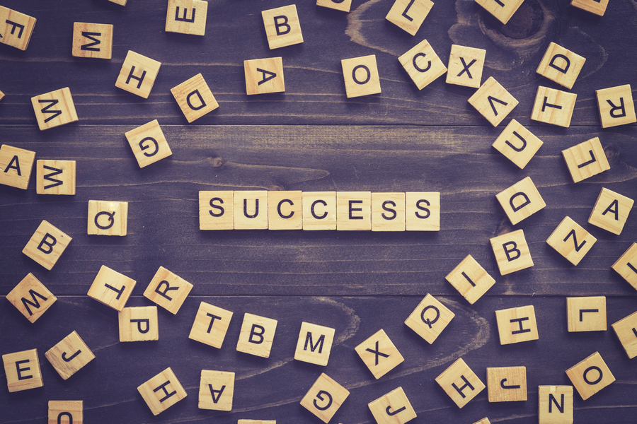 Scrabble board with the word success spelled out