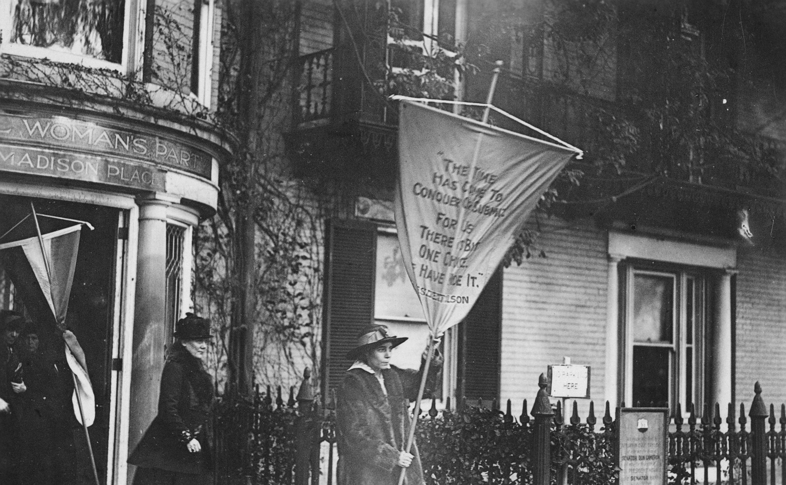 Alice Paul marching out to picket the White House