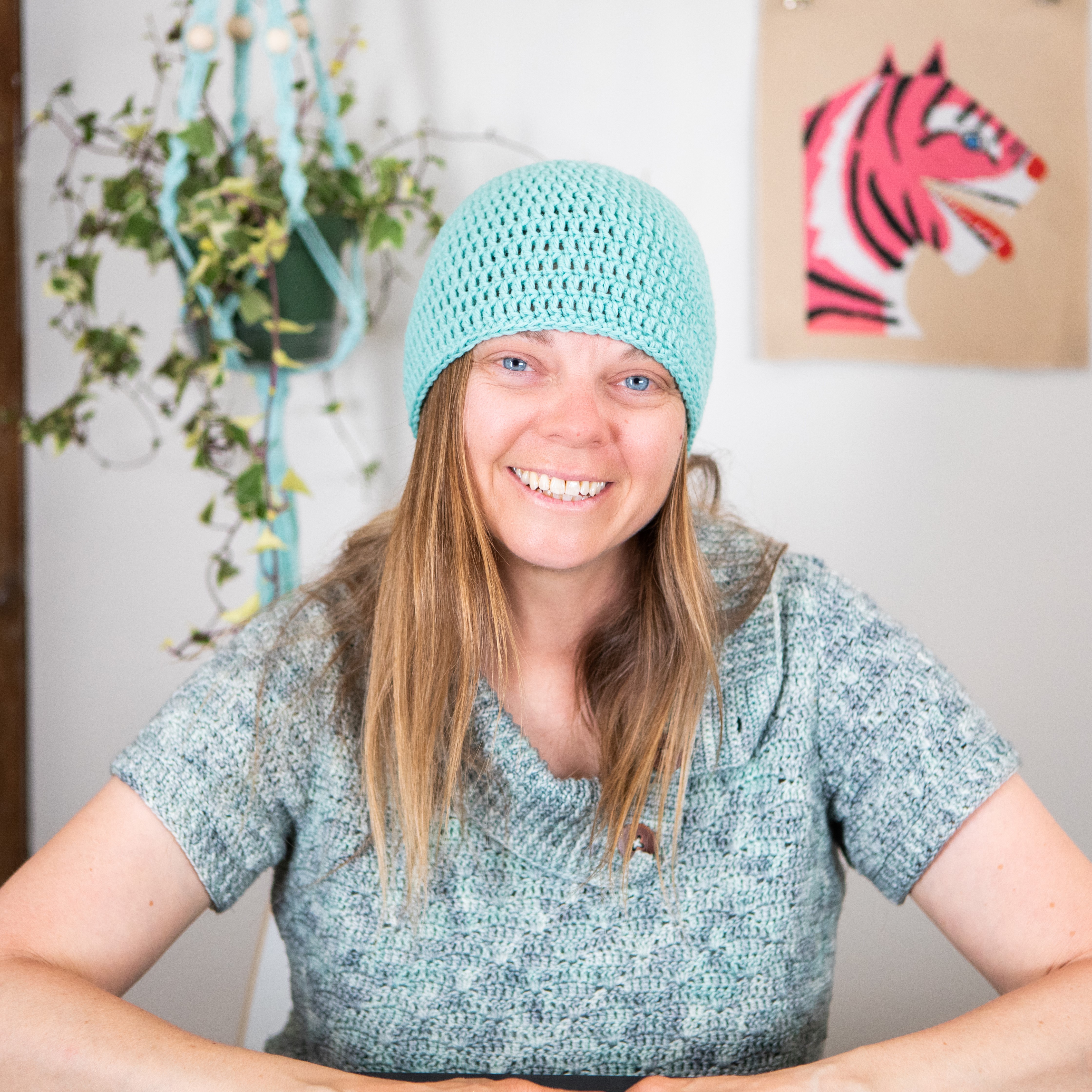 Dorian wearing a sample of the crochet hat