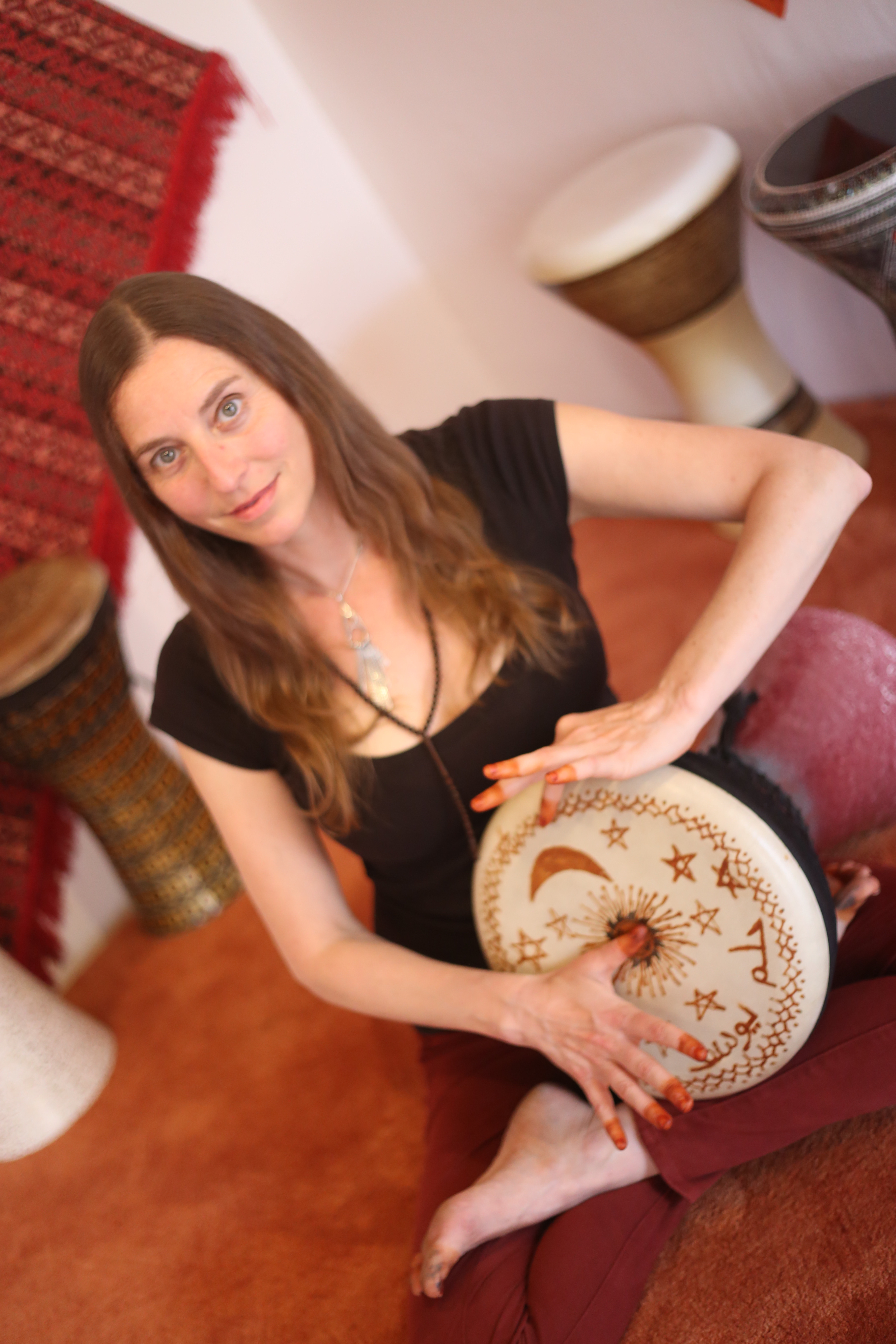 Raquy playing darbuka