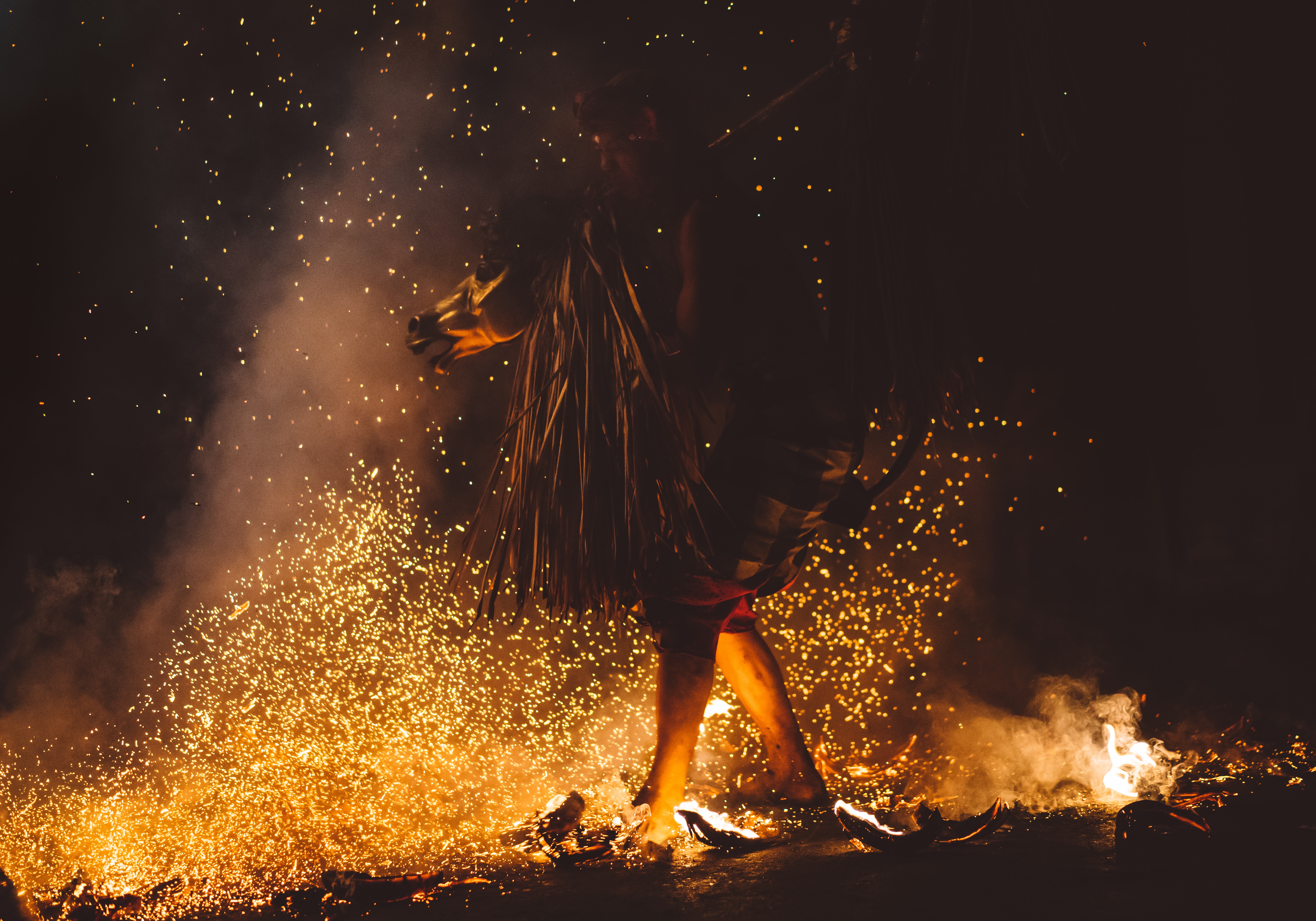 A shaman dances in a fire